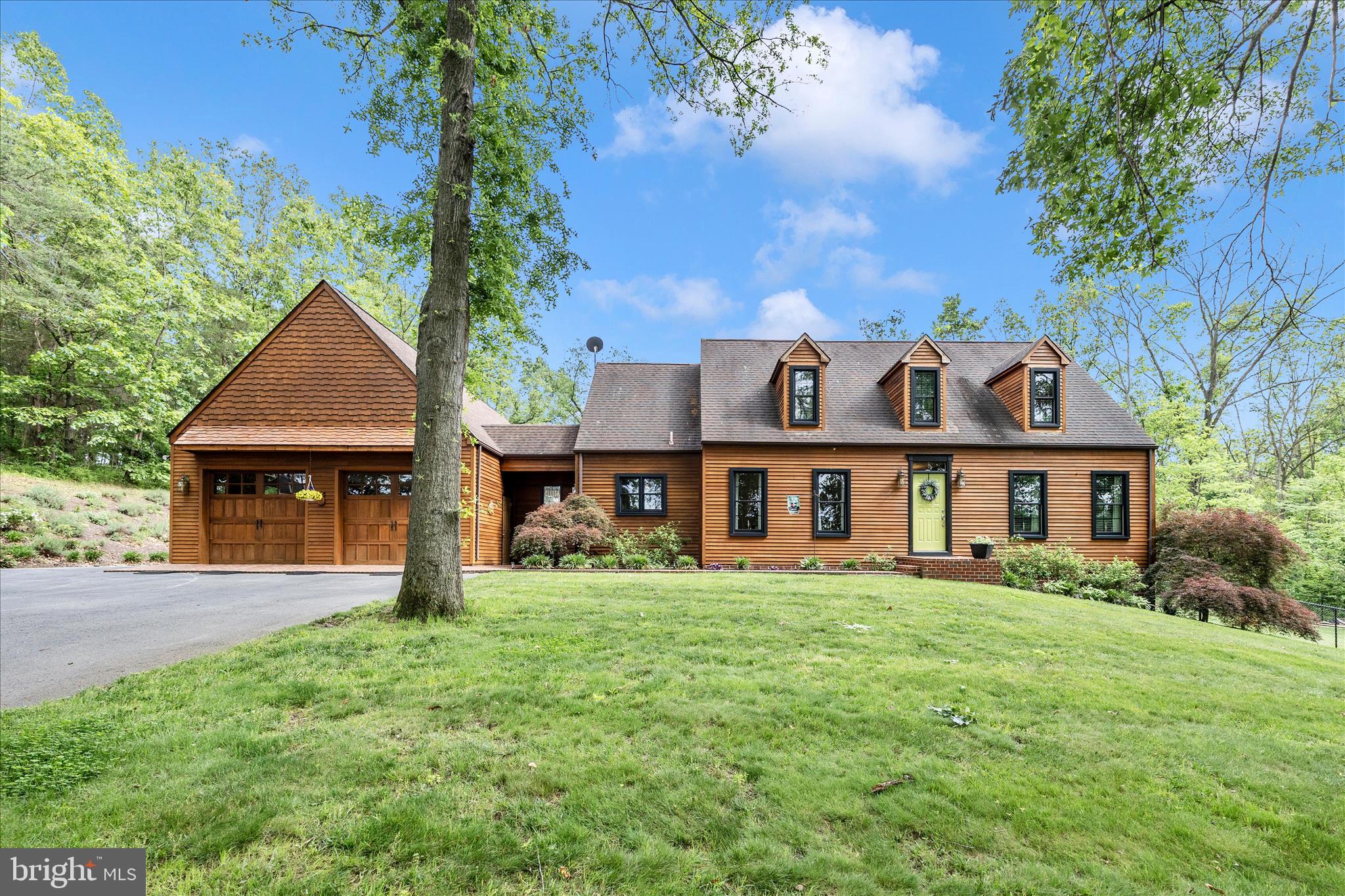 WELCOME HOME!  Gorgeous one owner custom home on 3.3 beautiful acres.  Approximately 2600 finished square feet (above ground).   Upgraded eat in kitchen with backsplash, marble and butcher block countertops, SS appliances, cherry cabinets open to large family room with pellet stove.  Separate dining room.  Foyer, half bath. First floor primary suite includes walk in closet and private full bath, marble top double vanity, oversized walk in shower.  Upstairs there are 3 additional bedrooms, a full bath and a great entertainment / sitting area with multiple potential uses.  The unfinished walk out basement has an improved area that could be a future legal 5th bedroom.  Basement laundry and wood stove.  Rear covered cove for relaxing. Rear patio looks over large fully fenced yard.  Large heated and cooled garage for 3 or 4 cars, or hobby / workshop space.  MASSIVE 14x46 area over the garage for storage or possible future living space!  Surrounding farm is in land preservation which means no building! 

*tax record is incorrect!  Home approximately 2600 above ground square feet PLUS unfinished basement, 2.5 baths.
