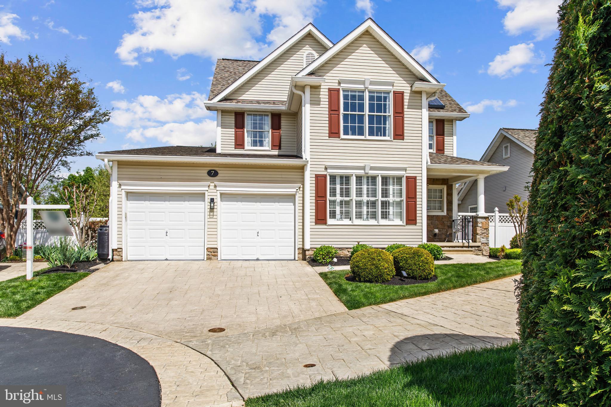 NEW PRICE! OPEN HOUSE SUNDAY 5/17 - 10:00-12:00! Welcome to 7 Derr Lane in the sought-after Villages at Foxfield—Middletown’s premier 55+ community—where Original Owners have meticulously maintained and thoughtfully upgraded this beautiful home, showcasing true pride of ownership everywhere you look. Perfectly positioned within walking distance to Middletown Park and its many amenities, this home also backs to serene woods, walking/jogging paths, and open green space—offering both convenience and some privacy. Enjoy peaceful mornings on the covered front porch or unwind in the backyard retreat featuring a walkout patio, koi pond, and a hidden “secret garden” be sure not to miss. Inside, the home blends comfort and modern updates. The kitchen is a standout with a Corian island, mosaic tile backsplash, stainless steel appliances (replaced 2019), induction downdraft cooktop, double oven, and ceramic flooring—ideal for both everyday living and entertaining. The main level boasts hardwood flooring (2018) and a warm, inviting family room with a propane fireplace and direct access to the newer, enlarged Trex deck (2022, with updated door in 2025). The spacious layout includes vaulted ceilings, a tray ceiling in the primary suite, and a dramatic two-story overlook with loft above. The primary bath was beautifully renovated in 2017, and the upper level features new carpet (2019). Additional updates include leased solar panels for energy efficiency (2018), washer and dryer (2021), vinyl fencing (2022), new roof and ventilation (2024), HVAC (2015), and water heater (2018). The unfinished lower level offers a walkout to the backyard, rough-in for a full bath, and a wide-open layout ready to be customized to your needs. Garage is equipped with a 200 amp 240 volt EV charging circuit and a newer garage door opener (2021). This is a rare opportunity to own a truly move-in-ready home in Middletown’s most desirable active adult communities—combining thoughtful upgrades, natural beauty, and a vibrant lifestyle.