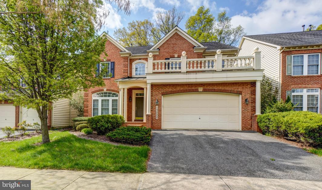 Lovely brick front colonial in Clarksburg Ridge offers over 3,400 square feet with 7 bedrooms and 4.5 baths with finished walk up lower level with two car garage, zoned heating and backs to trees.
Open floor plan has hardwood running through most of the main level with a two story overlook at the foyer.  Columns and molding give the space an elegant feel. The formal dining room has a beautiful inset in the hardwood flooring. The first floor study has French doors.  A powder room is also on the main level.    *****    
The large gourmet kitchen with morning room addition is open to the family room.  Kitchen features granite counters, stainless steel appliances including double oven, center island and breakfast bar.  Plenty of room for a breakfast table between the family room and kitchen.  The step down family room features a gas stacked stone fireplace.     *****    
Upper level has 4 bedrooms and 3 baths with 9 foot ceilings. Owner Suite has a tray ceiling and double door entry.  There is a huge walk in closet and luxury bath ensuite with separate shower, corner soaking tub, double vanity and separate water closet.  Laundry room is also upstairs.    ****
Bedrooms 2 and 3 share a connecting bath with double vanity, 12” floor tile and separate toilet and tub area.  Bedroom 4 has a bath ensuite.  All bedrooms are prewired for fans.   ****
The permitted lower level is reached via hardwood stairs with carpet.  Pergo flooring runs throughout the finished areas, including a step down to a living area and three legal bedrooms.  Second kitchen includes a refrigerator and wet bar with tile floor.  There is also an additional full bath and laundry room.     *****
Great location - walk to Little Bennett Regional Park.  Short drive to various shopping centers and Clarksburg Premium Outlets.  Short walk to bus stop going to Shady Grove Metro and short drive to I-270. School assignments are to Little Bennett ES, Rocky Hill MS and Clarksburg HS. Clarksburg is a master planned community and features a multitude of recreational opportunities, including paved trails, tennis, golf, camping, hiking, multiple play grounds and ball fields.