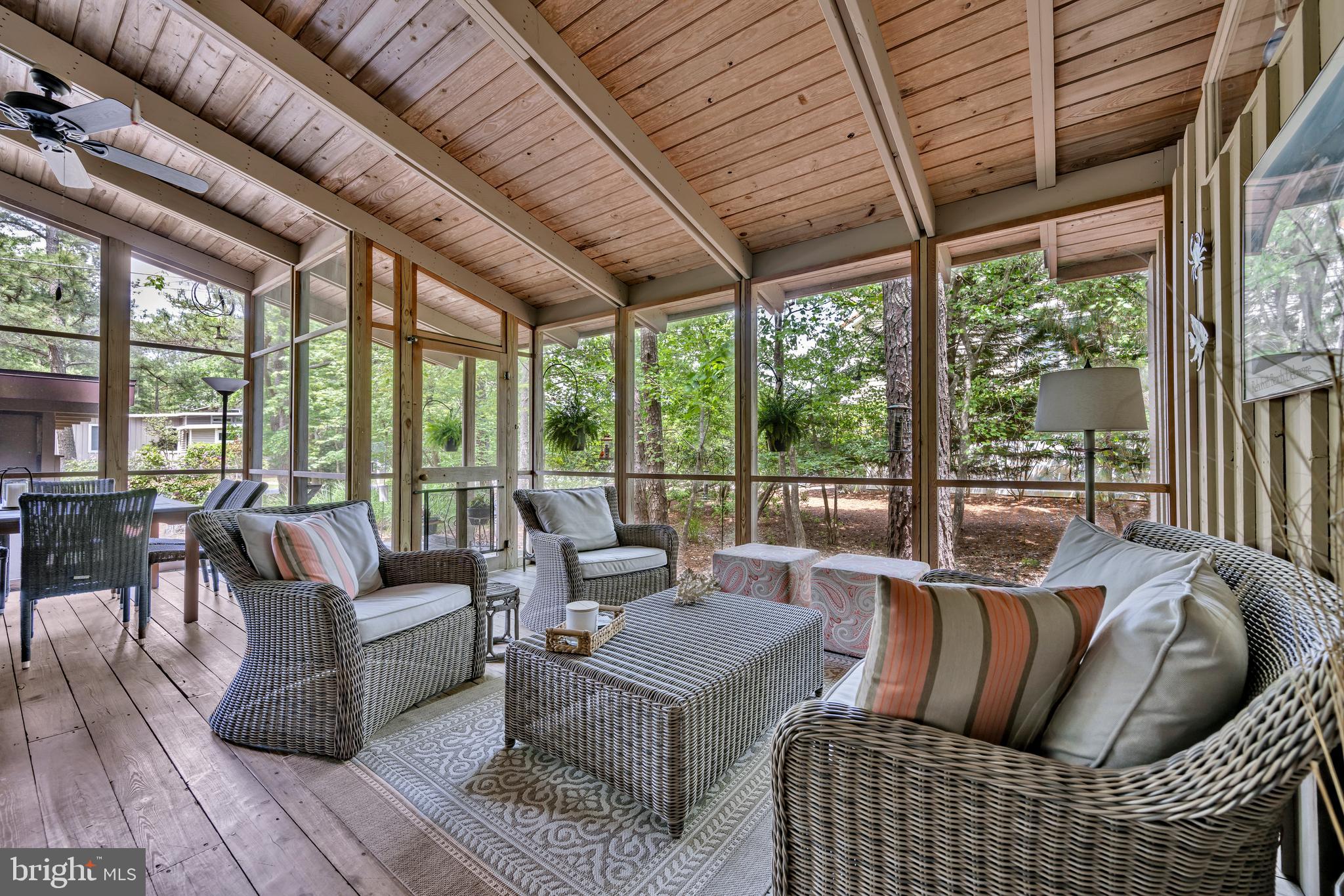 Do not miss this Original Owner Cherished Family Beach Cottage, sited on the largest lot (126x150) currently available in the Exclusive Private Ocean Front Community of North Shores in Rehoboth Beach.  Keep and love this wonderful  family cottage, or with the Rare Advantage of this Over-Sized Lot engage your Architect to Design your Dream Home at the Beach! Using Google Maps tour this exclusive neighborhood and see the stunning homes surrounding this cottage.   This Quintessential Atrium Style Beach Cottage on a Private Over-sized Landscaped lot offers 3 Bedrooms, 2 Baths, Hardwood Floors and Exposed Beamed Vaulted Ceilings thru-out, a Wood Burning Fireplace, Outdoor Shower, Large Carport and Storage, Circular Driveway and only 10 Homes from the Sand. Enter the Home via a Large Stunning Screened Porch with Hardwood Floors and Vaulted Beamed Ceiling, and then on to the Open Plan Living, Dining and Kitchen. The Master Bedroom with ensuite Full Bath is in the rear of the home and opens to the rear deck. The opposite side of the home is where you’ll find the 2 Guest Bedrooms, Hall Bath and access to the large rear deck. This is a seasonal home, however it has been enhanced with individual mini-splits in all the living spaces and bedrooms offering air conditioning and heat. Privileges of living in North Shores include a private and guarded beach, community pool, tennis courts, security, and marina. You are steps from Gordons Pond State Park and the Breakwater Junction walking/biking trail that takes you along the ocean and marsh all the way to Lewes. And you are just a bike ride to downtown Rehoboth Beach restaurants, shopping, and the Mile-long Boardwalk. Enjoy the rental income, keep it for yourself or Build your Dream Home.  Roof Main House – 2016; Roof Carport – 2017. Buyer must acknowledge all 2025 committed rentals.