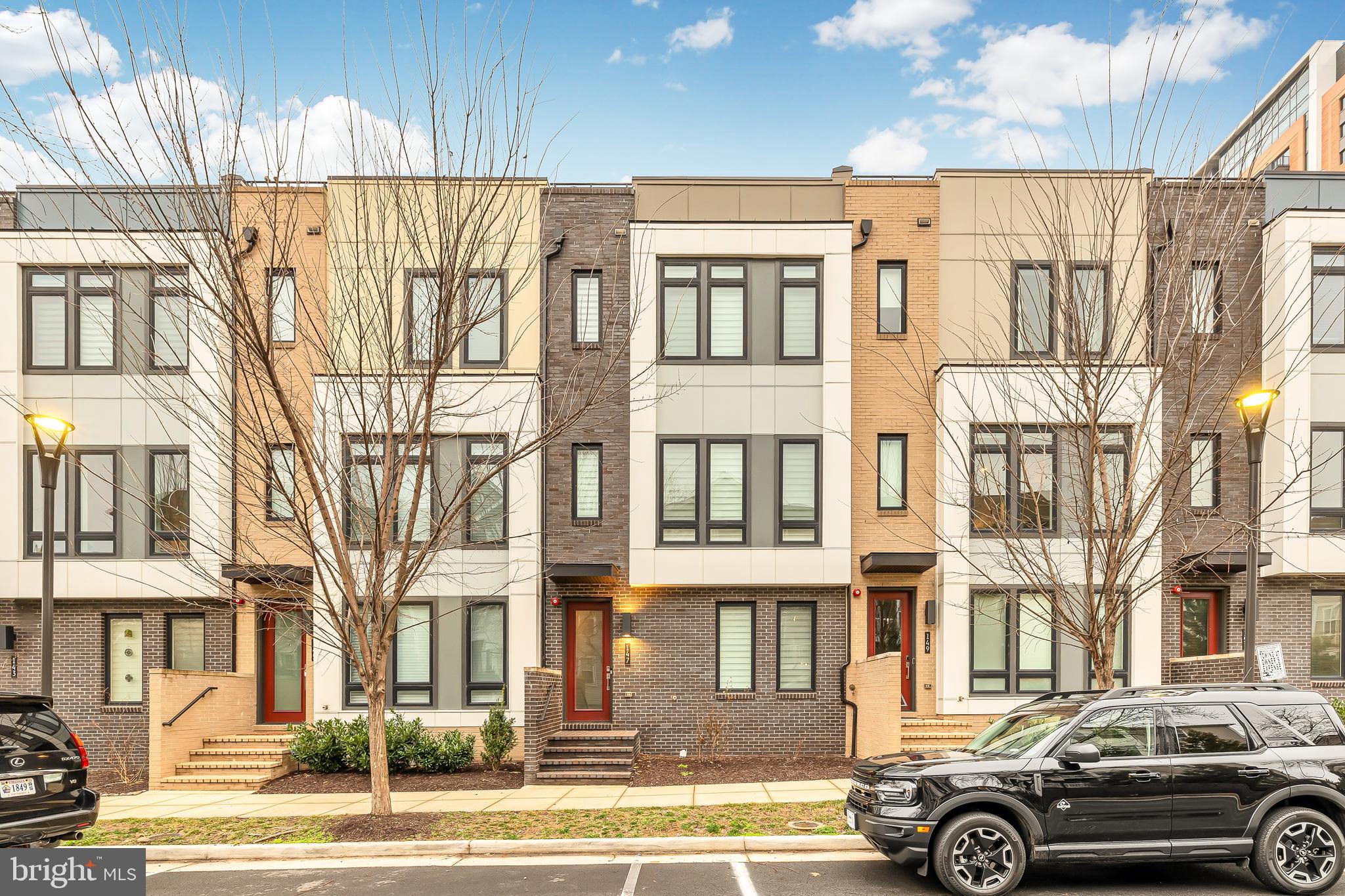 **Price Reduced to $5,200! Exceptional Townhome Available for Rent!** Welcome to Eisenhower Square, where luxury living meets convenience in the heart of Alexandria. From the moment you arrive, it's evident that this isn't just a place to live – it's a lifestyle.  Step into luxury with this stunning, almost never-lived-in townhome, now available at an incredible price!

Lower Level with Flex Space:  Let's begin our tour on the lower level, where you're greeted by a versatile flex space that can easily transform into your ideal home office, gym, or creative sanctuary. With access to a convenient half bath and a spacious double garage, this level seamlessly combines functionality with comfort.

Main Level Living:  This floor boasts a spacious and open layout, perfect for both relaxing and entertaining with 10-foot ceilings. First up, we have the chef's gourmet center kitchen, complete with a pantry room for all your storage needs. The kitchen features beautiful hardwood flooring, luxurious quartz countertops, and a stunning backsplash that adds a touch of elegance. The island with large pendant lights is not only stylish but also functional, providing seating for four bar stools and making entertaining a breeze! The dining area, illuminated by a captivating chandelier that's sure to grab your guests' attention. The family room it's the perfect spot to unwind and enjoy your favorite TV shows or sporting events. Ready for some fresh air, step out onto the private balcony with composite decking, ideal for evening chats or simply soaking up the sunshine. Whether you're working, studying, playing, or lounging, this home has got you covered. Half Bath and in-ceiling speakers with SONOS CONNECT AMP.

Upper Level:  Here, you'll find two spacious bedrooms, each with its own ensuite bathroom, offering privacy and comfort for everyone in the household. As you step inside, you'll notice a beautiful ceiling fan gently stirring the air, creating a comfortable atmosphere. Sunlight pours in through a wall of windows, filling the room with natural light and a substantial walk-in closet – plenty of space for all your clothing and accessories! The real showstopper is the primary bathroom, which rivals even the most luxurious hotel spa, it boasts double vanities with quartz countertops, beautiful tile from floor to ceiling, and a seamless glass shower door that adds a touch of sophistication, built-in shower seat, and enclosed toilet for privacy. 2nd bedroom it's equipped with its own ceiling fan for added comfort and features a full bathroom and a spacious walk-in closet – perfect for guests or family members. Washer and dryer in the hallway. 

Top Level Floor:  The very top floor is finished as the crown jewel of this home, you may never want to leave. No one will even know it is there if you don't tell! Penthouse style floor that has a stylish 3rd BR and adjacent BH. This level is all about entertainment and relaxation with state-of-the-art full surround sound speakers. Picture yourself hosting gatherings or simply escaping from the hustle and bustle of everyday life in this inviting loft area. And let's not forget about the wet bar with beverage fridge, which can easily transform into a coffee bar if that's more your style. The highlight of this floor is the rooftop terrace, accessible through glass sliding doors with upgraded tiles on the deck . Imagine sipping your morning coffee or hosting evening gatherings while surrounded by nature's splendor – it's truly a space where you can relax, unwind, and connect with the outdoors in comfort and style.

This beautiful home features: Gleaming hardwood floors throughout; Over $100k in upgrades, wireless access points for seamless connectivity, & recessed lighting in every room. Eisenhower Metro/Wegmans grocery  less than 1 mile and DCA Airport/DC just a short drive.  Indulge in culinary delights at Sweet Fire Donna's, Tequila Taco, Whiskey & Oyster, & Port City.  Contact us today for a tour.