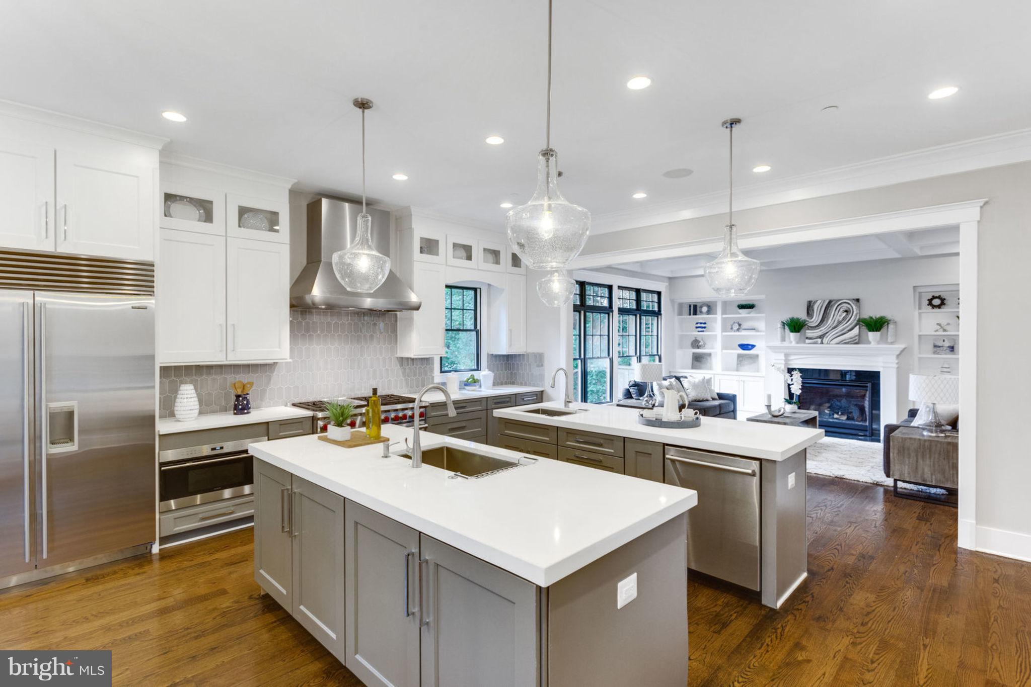 ALERT! END OF YEAR INCENTIVE! $30K CLOSING COST CREDIT TO BUYER FOR AGREED UPON & RATIFIED CONTRACT BY DECEMBER 31, 2018.  DON'T WAIT, THIS CREDIT OFFER EXPIRES AT THE END OF THE YEAR AND WILL NOT BE AVAILABLE IN 2019. USE THE CREDIT TO BUY DOWN YOUR INTEREST RATE A WHOLE POINT, OR USE IT TO REDUCE YOUR CLOSING COSTS AND CASH NEEDED TO CLOSE.  CALL FOR MORE INFO! Carolyn Homes presents this stunning new arts & crafts home by Mid-Atlantic Custom Builders. Three luxurious levels boast five bedrooms and four & one-half baths.Throughout the open, light-filled main level, you will find custom millwork, hardwood floors, 10  ceilings and many other high-end finishes. The gourmet, eat-in kitchen is achef s dream, outfitted with top-of-the line stainless steel appliances, including a Wolf commercial-grade gas range with two ovens, Subzero side-by-side refrigerators, and twoBosch 500-series ultra-quiet dishwashers. You will also find white quartz counters and two generously-sized islands perfect for cooking preparation & entertaining. If you careto dine al fresco, step outside and into the screened-in porch, featuring a gas fireplace, overlooking the serene backyard. An elegant dining room with wainscot molding, powderroom, private den, and light-filled family & living rooms complete the main level. The second floor boasts a master suite with a spa-like master bath featuring a frameless glassshower enclosure, Kohler Stargaze freestanding tub, and designer vanities. The master suite also features two expansive walk-in closets. An additional en-suite bedroom and two generously-sized bedrooms sharing a jack-and-jill bath are located on this level. You will also find a conveniently located laundry room and spacious second family room on the second floor. The lower level features a large recreation room with wet bar, a bonus activity room, an exercise room, the fifth bedroom & full bath, as well as ample storage space. In addition to all these wonderful features, this home offers a two-car garage and numerous Energy Smart capabilities. Located just moments from downtown Bethesda in the Oakwood Knolls neighborhood, thisnewly built home is a perfect 10!