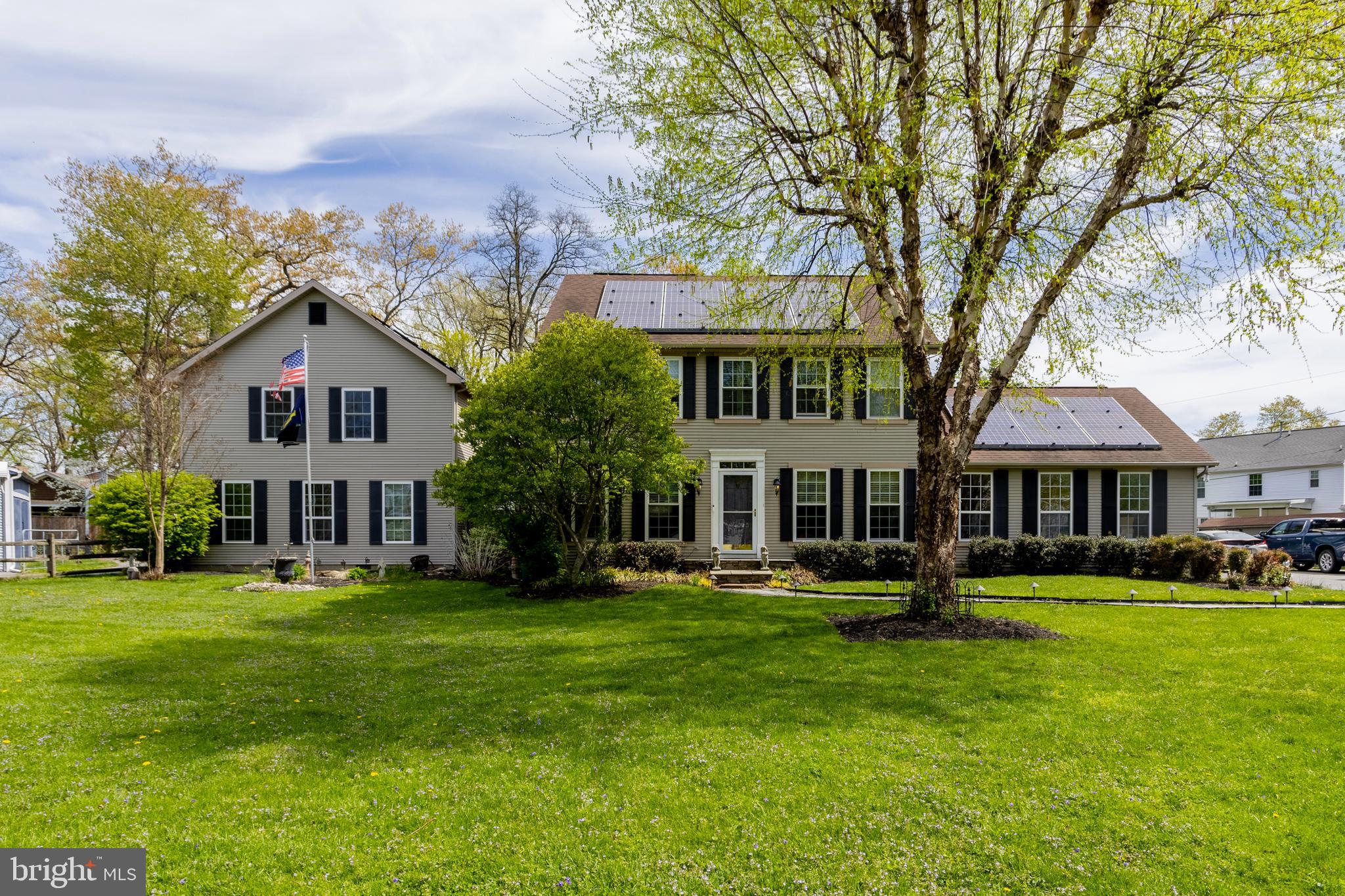 This is the one you've been waiting for! Set on a .76-acre lot, this expansive Colonial offers exceptional space and versatility! The main home features a large dining room with wood floors, a modern kitchen with stainless steel appliances and granite countertops, and a huge living room with a pellet stove. Enjoy additional living space in the family room with a gas fireplace, plus a convenient main-level laundry and full bath. The upper level boasts a spacious primary suite with walk-in closet and en-suite bath, along with three generously sized bedrooms and a hall bath. The partially finished lower level includes a rec room, den, and abundant storage. Need more space? A standout feature is the 2-story in-law/guest house addition with its own kitchen, living areas, bedrooms, and baths—perfect for extended family or guests. Step outside to decks, a hot tub, and plenty of room to relax or entertain. Additional highlights include an oversized 2-car garage, four sheds (including a boat-sized shed), and solar panels for energy efficiency. A truly versatile property with exceptional space and amenities.