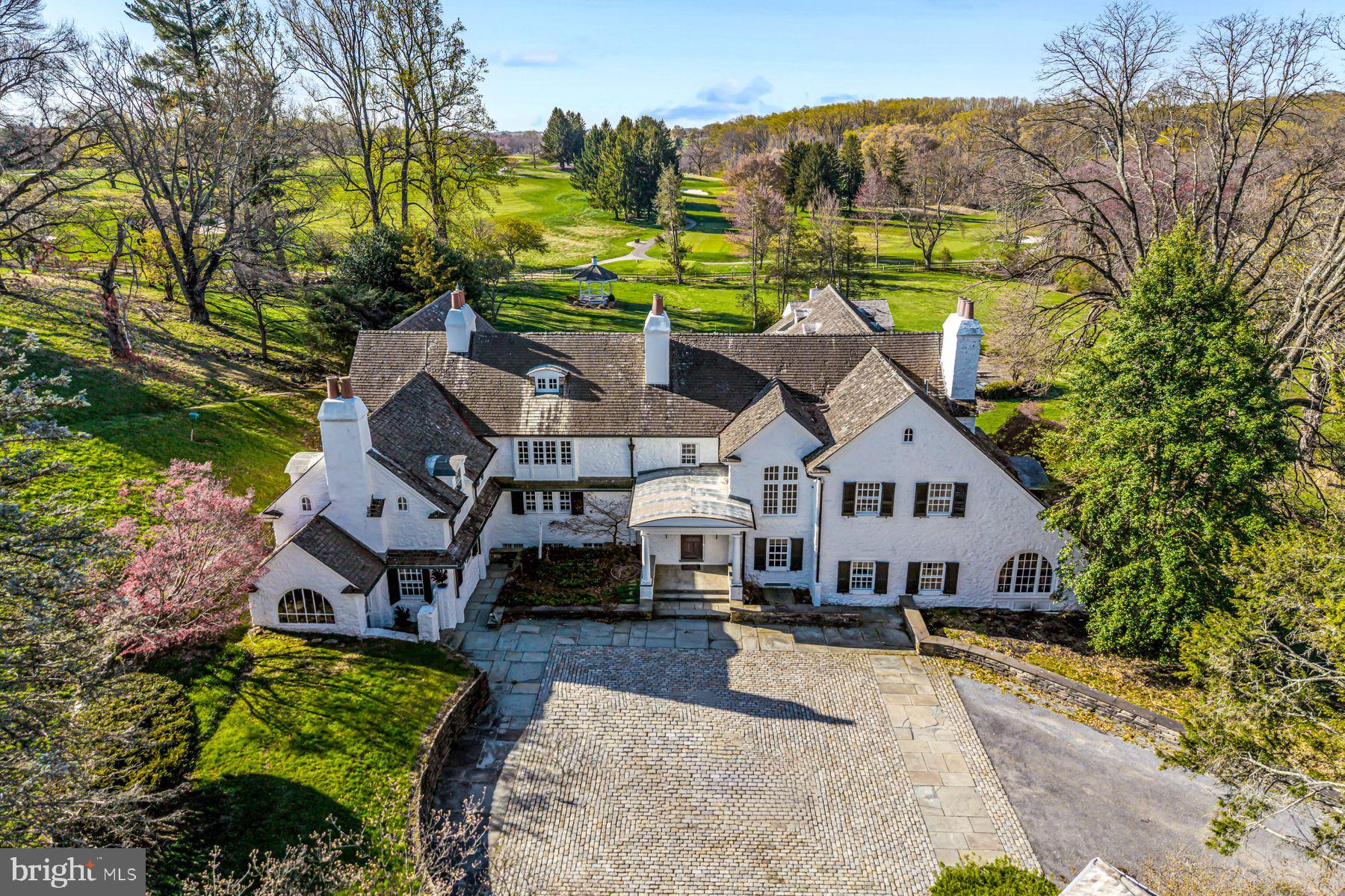 Capture this rare opportunity to be the next lucky stewards of this iconic Radnor Hunt Jewel. Set on a breathtaking 15.7 acre lot, down a long tree-lined driveway, this stunning stone residence, 2 guest houses, 5-stall horse barn, greenhouse, spacious garage, heated pool and pool house, offer every ingredient for gracious country living at its best. The original 1700's farmhouse has been thoughtfully restored and expanded by John Milner and Cullen Construction over the years and includes wonderfully open living and entertaining spaces, incorporating the sun-filled interior rooms with the ancillary buildings and private grounds. Endless features include a charming front to back foyer with original beams, 7 fireplaces, beautifully restored and replicated wide plank oak floors, beautiful living and dining rooms scaled to host large gatherings, a cozy bar room, rich study and expansive great room looking out over the expansive lawn, pool and gardens, country kitchen opening up to a convenient butler's pantry and bright breakfast room/ conservatory, second floor primary suite with sitting room, large walk-in dressing room, his and hers marble bathrooms and spacious bedroom, 5 additional bedrooms with en-suite baths including a private3-room au-pair suite and guest suite off of the second staircase, partially finished lower level with a true chef's kitchen, enormous wine cellar, entertaining room and more. Enjoy this priceless, oasis-like setting while being within a short ride on the surrounding riding trails to Radnor Hunt and just minutes from renowned schools, endless golf courses and recreational opportunities, fabulous restaurants, shopping and all forms of transportation. Owned by the same family for almost 40 years, this one-of-a-kind treasure is not to be missed!