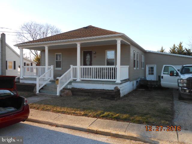 Everything is NEW! Wood floors & doors with natural wood trim throughout. Updated windows, new roof, new siding, fresh plaster & paint, new plumbing, ceramic & granite with stainless fixtures & appliances in custom kitchen. New bath with heated floor. Huge 1 car attached garage, shed, lean-to, paver patio & deck. Fenced yard & a built-in safe.