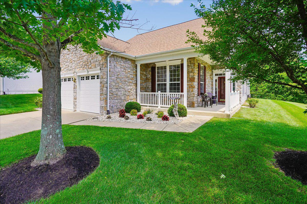 Your wait is over! This exceptional two-bedroom plus den patio home offers soaring 10-foot ceilings and expansive windows that fill the open floor plan with natural light. Gleaming hardwood floors, a dramatic two-sided gas fireplace, and custom built-in bookshelves create an elegant and inviting living space. The recently updated kitchen features quartz countertops, LG stainless steel appliances, and a bright breakfast room—perfect for everyday living and entertaining. Situated on a premium corner lot bordering wooded common area on three sides, this home offers exceptional privacy and beautiful natural surroundings. Enjoy watching deer, red foxes, wild turkeys, and a variety of birds from the meticulously landscaped yard, complete with a Rain Bird sprinkler system. Step outside from the family room to a custom stamped concrete patio featuring a SunSetter retractable awning and a Weber grill that conveys with the home. The thoughtfully designed floor plan places the two bedrooms at opposite ends of the home for maximum privacy. A versatile den provides the perfect space for a home office, library, or guest bedroom. Recent improvements include updated exterior lighting, Andersen storm doors, a new water heater, insulated garage doors with Genie garage door openers, as well as a newer roof and HVAC system. Residents enjoy outstanding community amenities, including a beautifully appointed clubhouse with a heated indoor pool, fully equipped fitness center, game room, and party room. Outdoor amenities include a swimming pool, tennis courts, bocce courts, and a putting green.