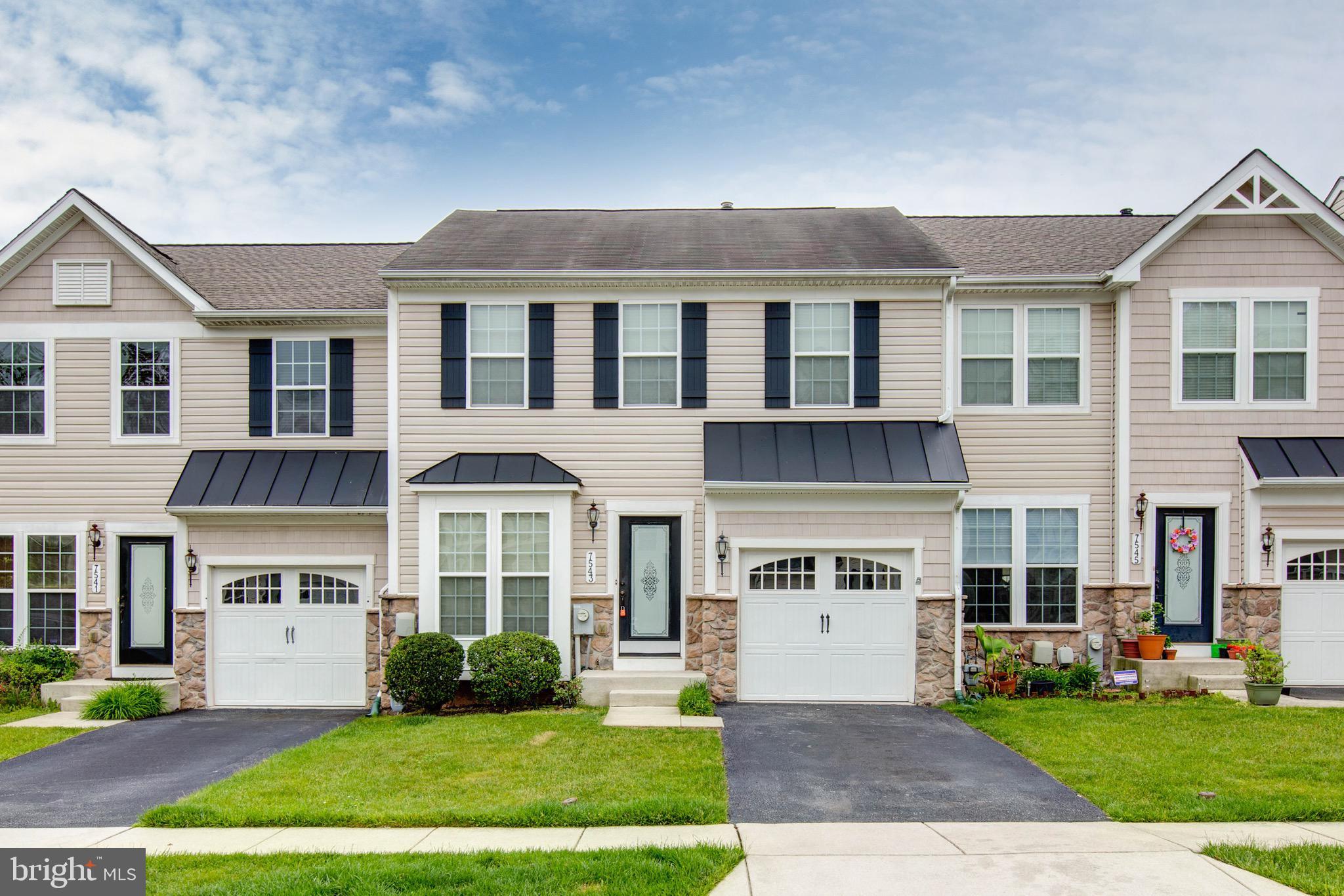 AVAILABLE NOW!  FRESH PAINT THROUGHOUT, NO CARPET, BRAND NEW VINYL PLANK FLOORING, AND NEW QUARTZ COUNTERTOPS!! Welcome Home to This Stunning and Spacious Garage Townhome! Ideally located with easy access to both Baltimore and Washington, D.C., this beautifully maintained 3-bedroom, 3.5-bath residence offers comfort, convenience, and style. Step into an updated kitchen featuring a morning room and sleek stainless steel appliances, complemented by gleaming hardwood floors in the kitchen and dining area. Enjoy outdoor living on the deck just off the main level. Upstairs, the primary suite includes a private full bathroom, while two additional generously sized bedrooms provide ample space for family or guests. The fully finished lower level adds versatility with a large rec room, a full bathroom, and an extra room perfect for an office, gym, or guest space. Additional features include a 1-car attached garage, a 2-car parking pad, and proximity to plenty of shopping and dining options. **Minimum credit score of 700 and proof of strong income preference. Landlord prefers a multi-year lease.