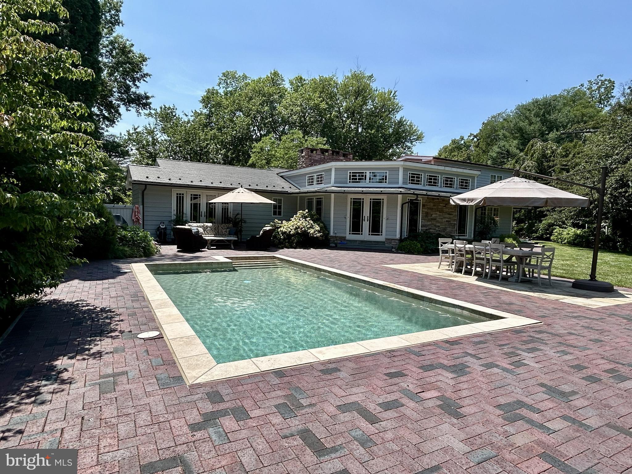 Welcome to One Country Club Lane, a lovely and spacious 1.5 story home sitting pretty on 1.3 acres with a heated inground salt-water pool IN THE Boro of Doylestown!  This MUST SEE PROPERTY has undergone an extensive renovation (2011) designed by architect, Judy Hendrixon, and constructed by J.R. Maxwell Builders.  The stunning addition/expansion includes a great room, Kitchen, 2-3 bedrooms, bathrooms, 3-car garage, storage space and more.  This home offers an amazing open floor plan with one floor living and an upper level en-suite or office space, 2 gas fireplaces, wood floors, custom moldings, custom built-ins throughout, security system, generator, 3+ car garage and more! No question about it, the "heart of the home" space is amazing Great Room/Kitchen space with an abundance of architectural interest including the amazing, "sun-capturing" transom windows, radiant heat, stone accent wall, natural light and French doors to the gardens, tiered patio, heated pool and charming frog pond with waterfall!  The special and amazing features of this home are too many to mention and must be seen to appreciate.  Country Club Lane is a privately owned lane, owned by one of the neighbors, and offers access to the Doylestown Country Club.  Steps to town, steps to the Cultural District/Mercer Museum, Michener Museum, and the Library....and a few more steps to the transportation center!  Location, Location, Location!  This is THE PLACE you will want to call Home!