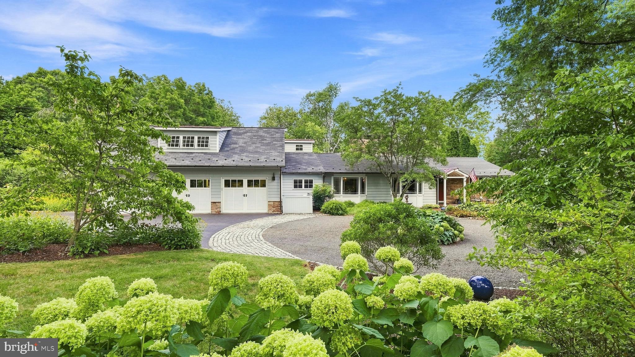 Look No Further....Welcome to One Country Club Lane, a lovely and spacious 1.5 story home sitting pretty on 1.3 acres with a heated in-ground saltwater pool IN THE Boro of Doylestown!  This MUST SEE PROPERTY has undergone an extensive renovation (2011) designed by architect, Judy Hendrixon, and constructed by J.R. Maxwell Builders and effortlessly blends timeless elegance with modern comfort.  The stunning addition/expansion includes a great room, Kitchen, 2-3 bedrooms, bathrooms, 3-car garage, storage space and more.  This home offers a "simply elegant" open floor plan with one floor living and an upper level en-suite or office space, 2 gas fireplaces, wood floors, custom moldings, custom built-ins throughout, security system, generator, 3+ car garage and more! No question about it, the "heart of the home" space is amazing Great Room/Kitchen space with an abundance of architectural interest including the amazing, "sun-capturing" transom windows, radiant heat, stone accent wall, natural light and French doors to the lush perennial gardens, tiered patio, heated pool and charming frog pond with waterfall creating an extraordinary setting for entertaining or peaceful relaxation. The special and amazing features of this home are too many to mention and must be seen to appreciate.  Country Club Lane is a privately owned lane, owned by one of the neighbors, and offers access to the Doylestown Country Club.  Steps to town, steps to the Cultural District/Mercer Museum, Michener Museum, and the Library....and a few more steps to the transportation center!  Location, Location, Location!  This is THE PLACE you will want to call Home!