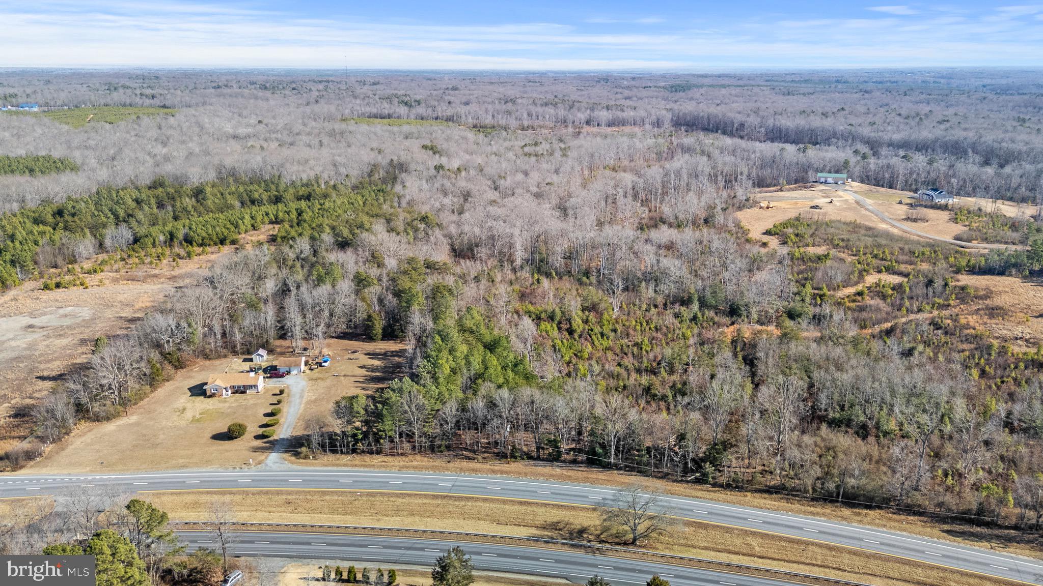 Rare opportunity to own 28 +/-  acres of pristine, wooded land with frontage on James Madison Parkway (Route 301) in King George County, Virginia. This expansive tract offers a private, natural setting with excellent visibility and convenient access to major commuter routes.  Possible for subdivision.  LOE, soil evaluation  completed  in 2021 indicate the area would support at least 4-bedroom conventional septic system.  The site has been staked as Site 1-M (see soil documents attached).  Proximity to the Potomac River, Caledon State Park, and other natural attractions. Close to shopping, dining, commuter corridors, and outdoor recreation. 25 miles to Fredericksburg,  65 miles to DC, 55 miles to Richmond.  CONTACT THE AGENT FIRST TO SHOW PROPERTY AND FOR MORE DETAILS.