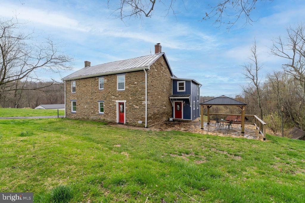 Nestled on over 80 acres of pristine land, this charming historic farmhouse offers 3 bedrooms, 2 full baths, and a bonus room on the second upper level that can easily serve as an additional bedroom or a home office.  This home is a unique sanctuary for those seeking privacy and serenity.

The farmhouse has been fully renovated to include all the modern conveniences, while preserving its original authenticity and character. Whether you're relaxing on the covered front porch, enjoying the tranquility under the stars on the rear patio, or exploring the miles of hiking and walking trails, this property offers an unparalleled outdoor experience. The nearby stream invites you to unwind with fishing or swimming, with the water recently tested for peace of mind.

Please contact listing agent  for showings.


While you're surrounded by nature, you'll also enjoy easy access to major highways like 140 and 795, offering the best of both worlds: the quiet seclusion of country life with the convenience of nearby amenities.

As a tenant, you’ll have access to the vast acreage, but are only responsible for maintaining a smaller yard space of about an acre or less. The land offers plenty of opportunity to grow crops or cultivate a garden, perfect for those with a green thumb.

This home is waiting for its next steward—someone who will appreciate the land, the lifestyle, and the timeless charm of this special farmhouse. Come experience the peace, beauty, and possibilities of life on this remarkable property.