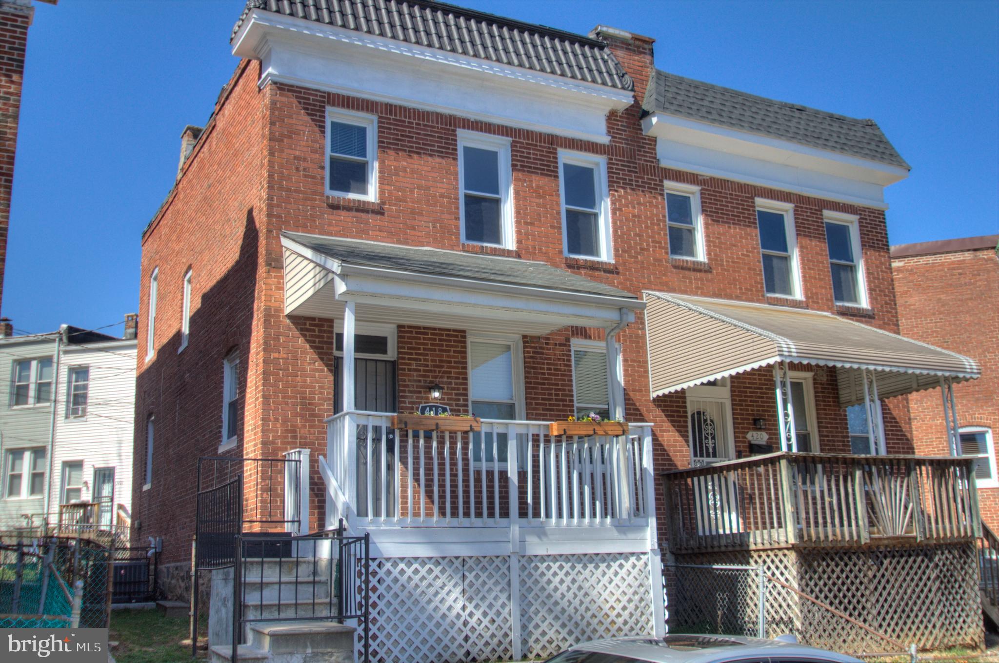 Beautifully refreshed and renovated, enjoy this affordably priced porch front end unit featuring four bedrooms including the totally renovated basement and two full baths as well as a spacious and handsomely decorated dining room, living room and renovated kitchen. The  following are brand new items: High efficiency Rheem gas furnace and AC, electric water heater, basement and first floor water proof luxury vinyl plank, refrigerator with water and ice dispenser, quartz counter tops, electric oven, microwave, stainless steel sink, designer black faucet, extra tall cabinets, main floor blinds, basement tub, bathroom lighting, fresh paint throughout, kitchen, dining room,  living room and hall light fixtures, beautiful primary bath with tile, tub and shower and designer black fixtures,  vanity and light, toilet, extra shelving, towel racks, primary bedroom light fixture.

The kitchen includes a dishwasher and disposal and the basement has a helpful walk out for getting furniture downstairs. Street parking in front of the house is plentiful. The basement includes a washer dryer. Enjoy the front porch and low maintenance front and rear fenced yards.

This is home ready to move into with almost nothing to do. First time home buyers have access to mortgage and closing assistance. Excellent rental potential.