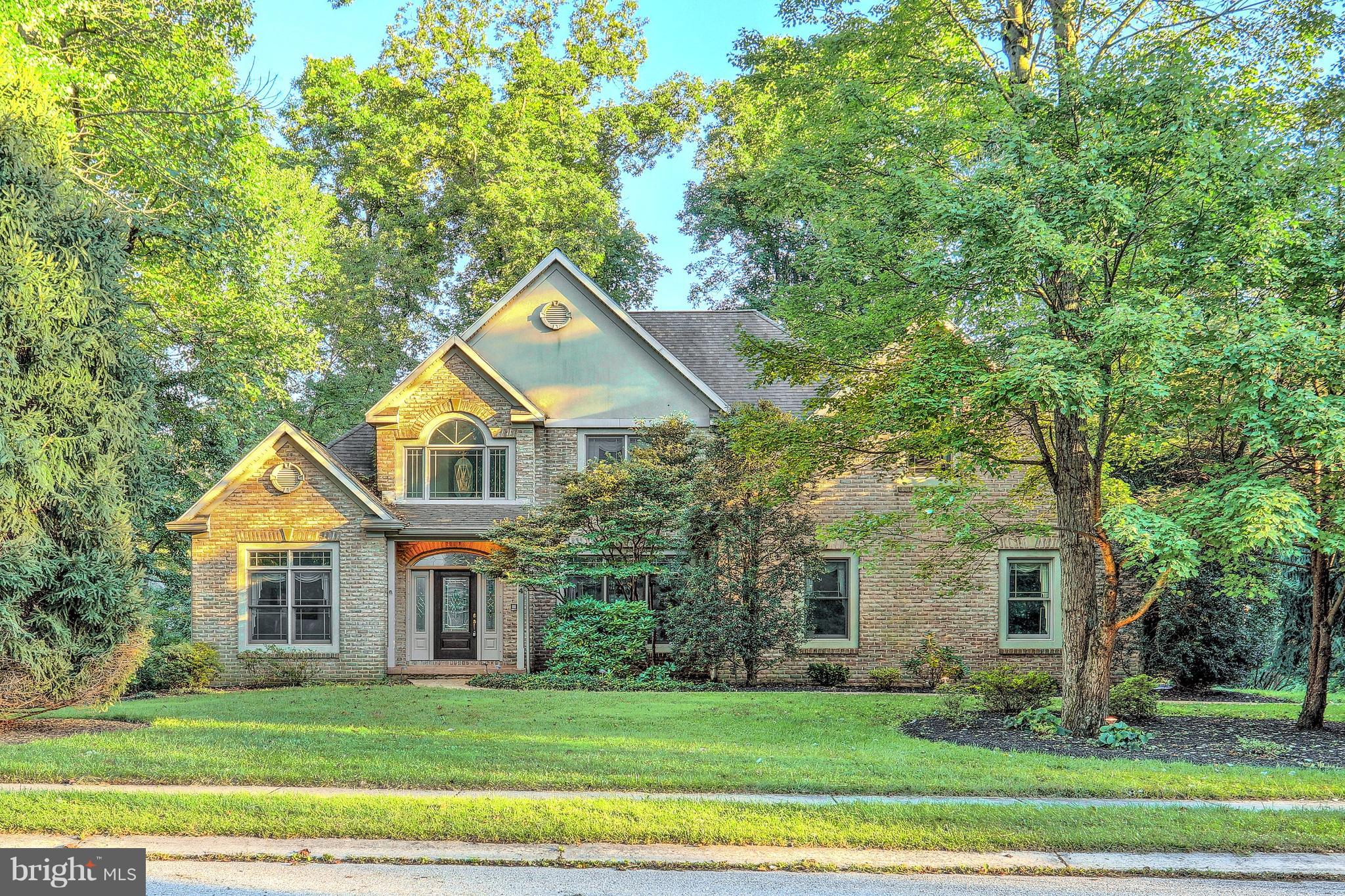 Fabulous custom built home with luxurious first floor master suite. 2 story foyer with marble tile floor and palladium window. Open floor plan. Family room with cathedral ceiling, gas fireplace and access to spacious deck. Formal dining room and living room/office. Great kitchen with ceramic tile, corian countertops, center island, recessed lighting, wall oven, gas cooktop, dining area. Master suite with tray ceiling, door to deck and luxurious bath with whirlpool tub, walk-in shower,ceramic tile, double bowl vanity, water closet with bidet.  Laundry room with utility tub and powder room complete the first floor.  The second floor boasts a landing with built-in bookshelves, spacious bedrooms with walk-in closets, an unfinished room easily finished into a 4th bedroom and walk-in attic storage space. Main bath with ceramic tile. Oversize 2 car garage, great lot and curb appeal plus!! Security system, intercom, central vac are just some of the fine amenities in this home.
