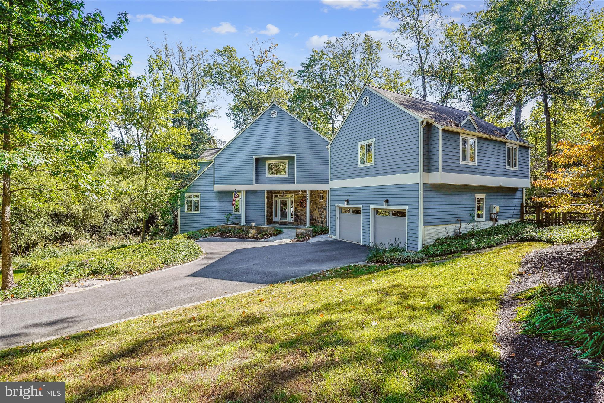 Welcome to this unique, sunny, open & bright home on a private, landscaped 3/4 acre lot in wonderful, woodsy and convenient Franklin Park. Offering 5+ bedrooms and 5.5 baths, perfectly designed for comfort and style. The main level boasts gleaming hardwood floors, a spacious living room, formal dining area with a stone front gas FP. Convenient pocket doors provide easy access from the Dining Room to the gourmet, eat in kitchen with Island and Table seating, Stainless Steel Appliances and tons of storage, counter & cabinet space. Adjacent to the gourmet kitchen, the family room impresses with vaulted ceilings, oversized windows and two sets of French doors that lead to a covered porch with fire pit and an expansive deck that are ideal for al fresco dining and enjoying the outdoors. The main level also includes a private home office with custom built-in bookcases. This office can easily be converted into a bedroom with a private ensuite bath. Upstairs you will find the deluxe Primary Suite with walk in closet and luxurious bath. Note the 2 sided shower! Plus, 4 generously sized bedrooms, 3 full baths, and an additional office for work or study. The walk-out "daylight" lower level includes a large recreation room, separate bedroom, oversized den/workout/movie room, full bath and ample storage space. The garage has an EV Plug plus plenty of space for all of your "Big Kid Toys"! Convenient Mud Room with sink, built ins, Cubbies and Laundry. Sitting on a gorgeous ¾-acre lot, this property offers privacy and space while remaining close to all McLean has to offer. Don't miss the opportunity to make this exceptional home yours!