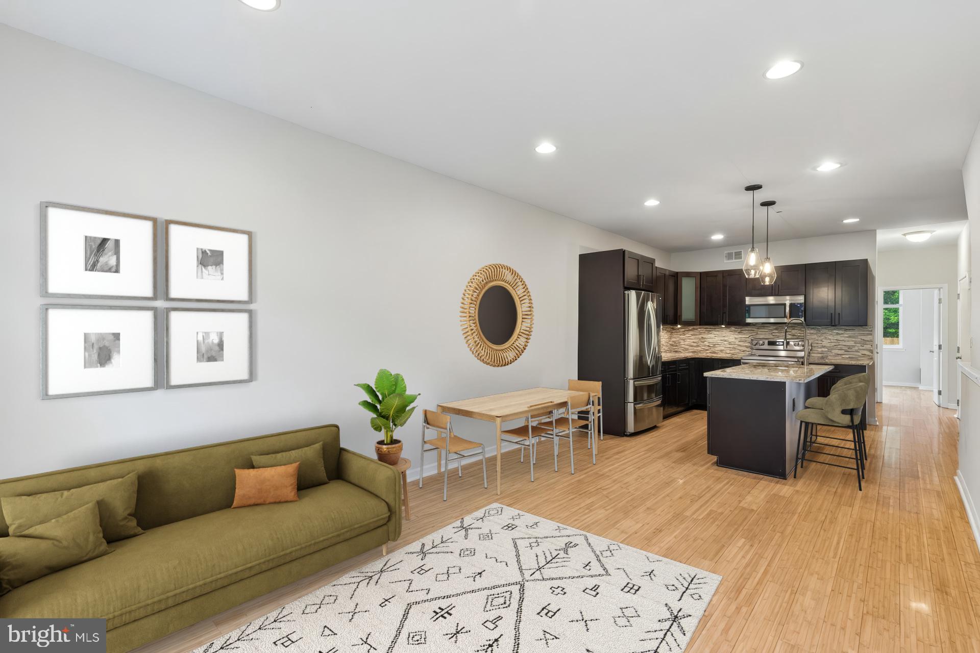 3 levels, 3 bedrooms, multiple living spaces, parking, expansive patio; 1211 Mount Vernon Street #1 has it all. This unique condo has been thoroughly prepared for sale and is ready for your vision. What makes this house so unique is its functional layout. Extending over 3 levels there is a bedroom on each floor as well as a full bathroom on the first and second floor, and half bath downstairs. Upon entering the house you’ll walk into an open floor plan with 8 foot ceilings and hardwood floors, where you’ll find the main living room and kitchen. The kitchen features a large island, new LG stainless steel appliances, granite countertops, chestnut cabinets with custom hardware, and glass backsplash. Down the hall there is a full bathroom as well as the first bedroom, where large windows allow you to overlook the back patio and let in loads of natural light. Upstairs is the primary suite with a large closet and en suite bathroom, including glass enclosed shower and modern tile accents. You'll also notice custom privacy blinds on all windows thoughout the house.

Downstairs is a completely finished lower level which can be used as a variety of spaces including a second living area, gym, workshop, office and more. Additionally, there is a flex room with egress that could be used as a 3rd bedroom or expanded into the living area as a den. Completing this space is a half bathroom and laundry room. At the rear of the property is a private hardscaped patio that leads directly to an un-deeded parking spot on an unused lot. No need to circle the blocks searching for parking, you can pull right in and walk through your patio directly into your home, the ultimate convenience in the city. 1211 Mount Vernon is located near neighborhood hot spots like Union Transfer, Prohibition Taproom, La Chinesca, Love City Brewing, Cafe Lift and more. You can also easily hop on the Broad Street Line and be downtown in minutes. Make your appointment today to see your future home.