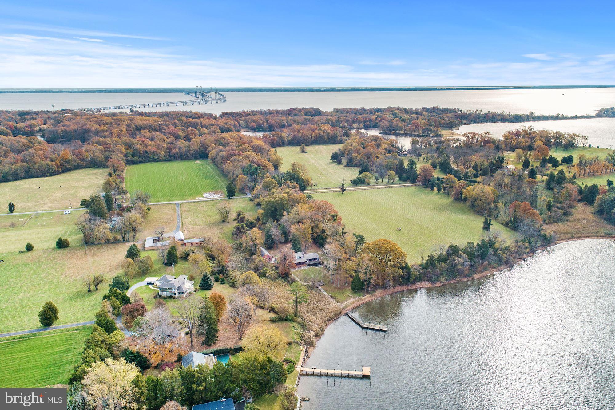 EXCEPTIONAL WATERFRONT OPPORTUNITY.  Expansive views of Whitehall Creek on 2.76 acres with a 4 car detached garage.  This is the renovation opportunity you've been waiting for!  Existing home has great bones and is elevated with a gentle slope to the water's edge.  It features 3 levels, 4/5 bedrooms, 3 full bathrooms, and a main level full sized in-law apartment.  This one owner home is an estate sale and is being sold AS-IS.  Recent appraisal in-hand for $1.6M.  Recent perc test and site plan in-hand.  Please do not drive down driveway without an appointment.