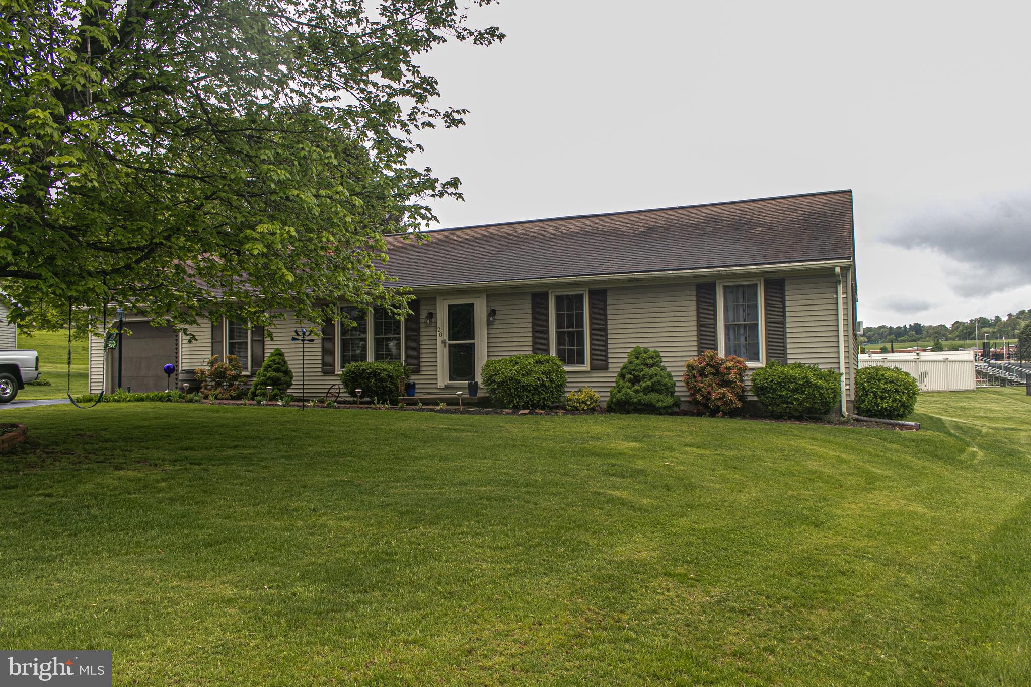 Come visit this beautiful four bedroom two bath rancher in Spring Grove Area School District. Walk through the front door to a lovely stone fire place and dark laminate flooring. To your right are three bedrooms  with   their own closets and a full bath.  Walking through the kitchen you can access the dining room or walk through a beautiful laundry room to a spare bedroom with it's own full bath. Having guests has never been easier. Off the dining room is a sun room that overlooks the fenced in pool, if you look further you can see the ball fields for Spring Grove Area School District. You don't want to miss this gem in a quiet close knit neighborhood. Schedule a showing today!
