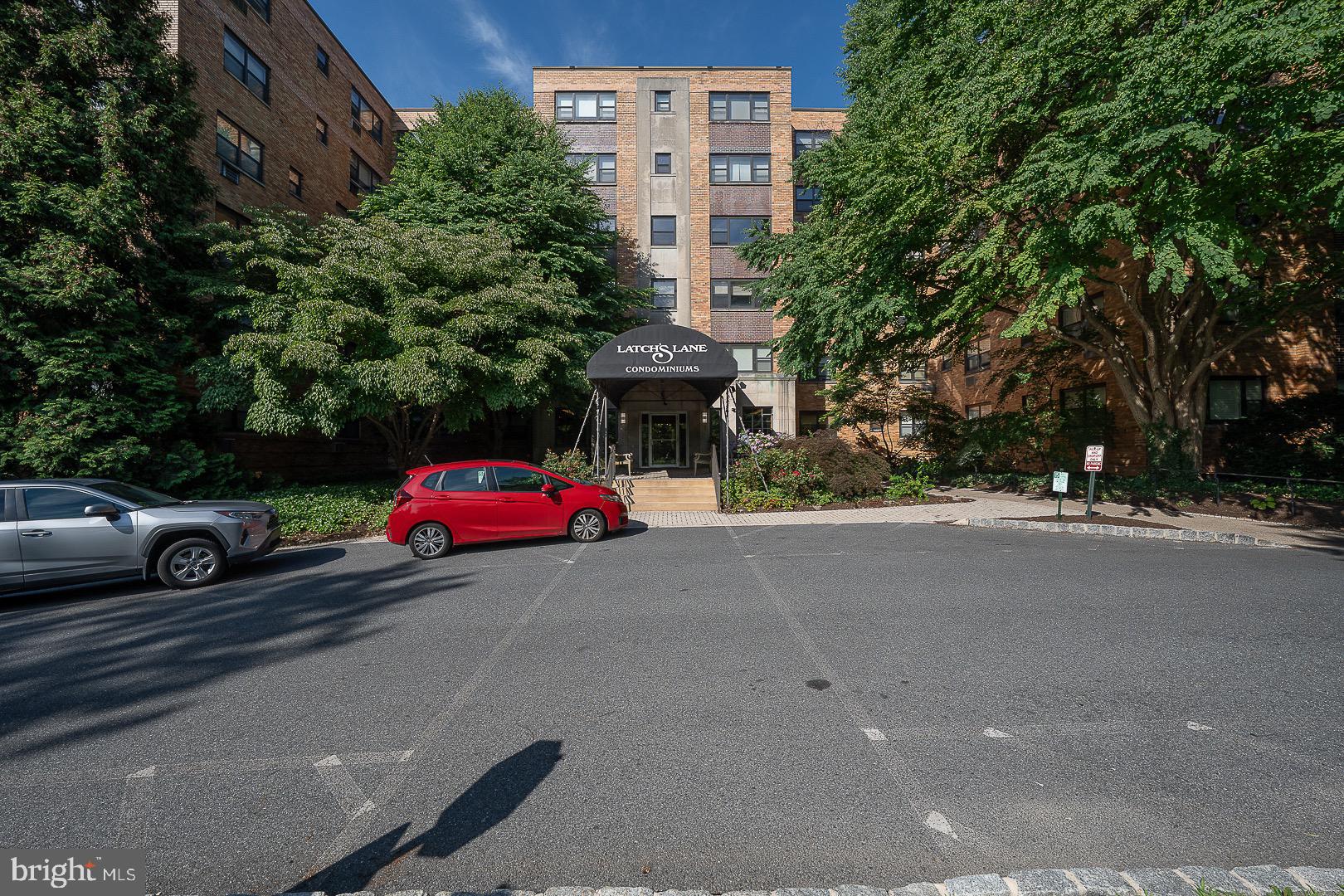 One of the largest one bedroom unit with  961 sq ft and washer/dryer in the unit at Latches' Lane, Lower Merion.    This pristine sunny first floor, corner unit faces the backyard .  One bedroom and one bath with expansive Living Room, Formal Dining Room, and newer kitchen with granite countertops and new  kitchen flooring.  Large foyer entry with built-in storage unit.  Hardwood floors. Washer/dryer in the unit! 3 new  AC wall units.  Basement storage locker.  Latches' Lane has a fitness room, a lower level laundry room, social room, indoor/outdoor parking ( indoor parking has an additional small monthly fee)and has an outdoor swimming pool.  Condo fee includes water, gas, trash, and ground upkeep.  Management office on the first floor.  Great Lower Merion location! Close to transportation, library, shops, and restaurants.
