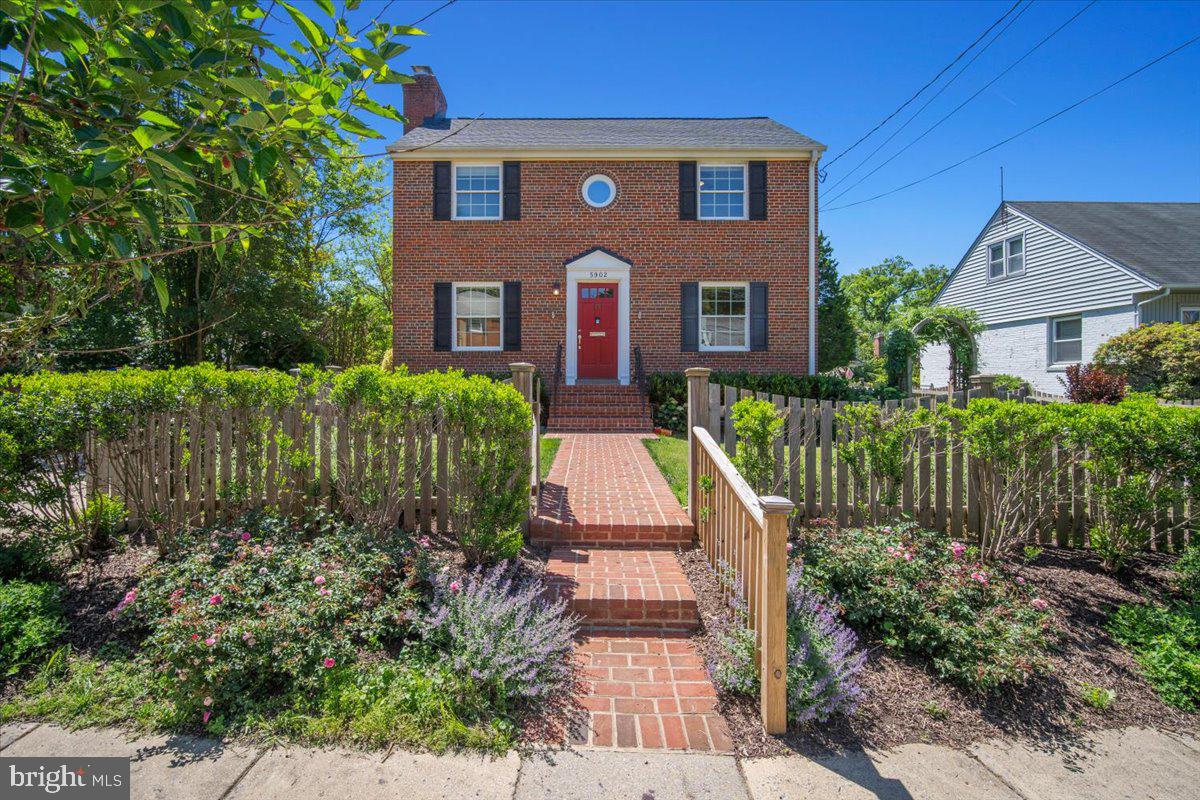 Welcome to this beautifully updated and meticulously maintained brick Colonial in the highly sought-after Wyngate neighborhood of Bethesda. Perfectly situated on a quiet, tree-lined street, this timeless home combines classic charm, thoughtful updates, and an unbeatable location just moments from everything Bethesda has to offer.

Step inside to discover a spacious main level with exceptional flow, ideal for both everyday living and entertaining. The inviting living room features custom built-in shelving and cabinetry, a cozy wood-burning fireplace, and abundant natural light. Just off the living room, a sun-filled flex space with a separate entrance offers endless possibilities as a family room, home office, guest space, or playroom.

The heart of the home is the beautifully appointed kitchen, featuring granite countertops, stainless steel appliances, and easy access to both the formal dining room and rear deck. Whether hosting dinner parties or enjoying a quiet morning coffee, the seamless indoor-outdoor connection makes entertaining effortless. Step outside to a private, fully fenced backyard surrounded by mature landscaping, blooming roses, peonies, and a stunning wisteria-covered trellis.

Upstairs, you'll find three spacious bedrooms and a recently renovated full bathroom. An attic with pull-down stairs provides exceptional storage for seasonal items and household essentials.

The finished lower level offers even more living space with a large recreation room, updated full bathroom, and versatile bonus room perfect for a gym, guest room, hobby space, or additional office. Walk-out access leads directly to a beautifully hardscaped patio, creating another inviting outdoor retreat.

This home has been lovingly cared for and extensively improved, including a new HVAC system, new roof, new water heater, new washer and dryer, refinished hardwood floors, basement waterproofing and sump pump, new kitchen recessed lighting, professionally painted interior walls and trim, new fencing, and extensive front yard hardscaping.

Location truly is everything. Enjoy living just minutes from Wildwood Shopping Center, Downtown Bethesda, NIH, Walter Reed , Suburban Hospital, and Westfield Montgomery Mall. World-class dining, shopping, entertainment, parks, trails, and top-rated Montgomery County schools are all at your fingertips.

Wyngate is beloved for its strong sense of community, highlighted by its annual Fourth of July celebration featuring neighborhood parades, games, music, and family-friendly festivities that make this one of Bethesda's most cherished places to call home.

This is a rare opportunity to own a move-in-ready home in one of Bethesda's most desirable neighborhoods. Welcome home.