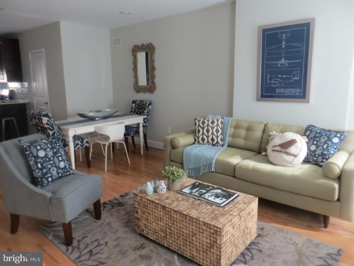 Welcome to this beautiful, newly renovated home located on one of the nicest blocks in the Point Breeze area. Enter the home to an open floor plan with living room, dining area,powder room, and nicely flows into the kitchen. The modern kitchen has 42" high end shaker cabinets, beautiful granite backsplash,and stainless steel appliances. The extremely large rear yard has a privacy fence,new concrete patio, and ideal for those who enjoy the outside. The finished basement has porcelain tile flooring that adds to the beauty and spacious feel of this home. The second floor offers two well appointed and large bedrooms both with plentiful closet space.There is a spacious full bathroom with modern finishes, double vanity, tub, and custom stand up shower. The second floor is complete with it's own laundry area. Follow the steps up to an amazing rooftop deck with breathtaking views of the city. The location is a short walk to Graduate Hospital, Center City, East Passyunk, and Passyunk Square. It is also situated on a block which is very wide and easy for parking. You will feel at home the minute you walk in. One of the owners is a licensed Real Estate Agent