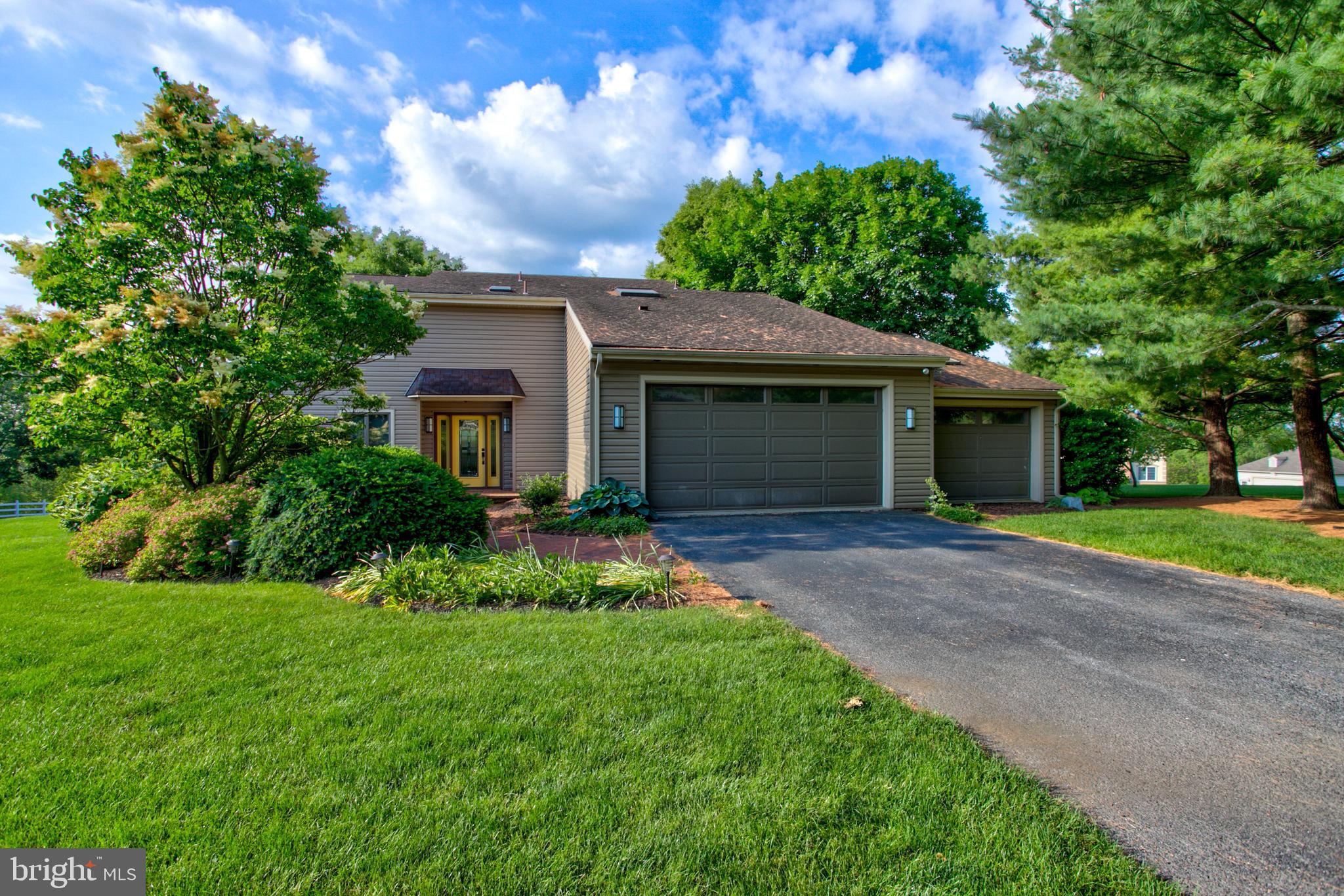 Stunning contemporary home! Be prepared to be delighted from the instant you enter. This home is filled with natural day light throughout– Morning day break to evening sunsets. Gorgeous scenic views from every window –even bask in the glow of the full moon! The inviting open floor plan will be perfect for entertaining and/or spending time with family. The first floor boasts of a two story great room with stone accented propane fireplace opening to a spacious updated kitchen with super-sized island, gorgeous sunken formal dining room with hardwood, a first floor bedroom or office and a full bath. Travel upstairs to find two additional bedrooms one with double walk in closets, second updated full bath with tile shower and convenient laundry.  Enjoy outdoor living on the trex deck or relax on the screened in porch while enjoying spectacular scenery. While you may feel as if you are living in the country, this home is still conveniently located to all necessities.