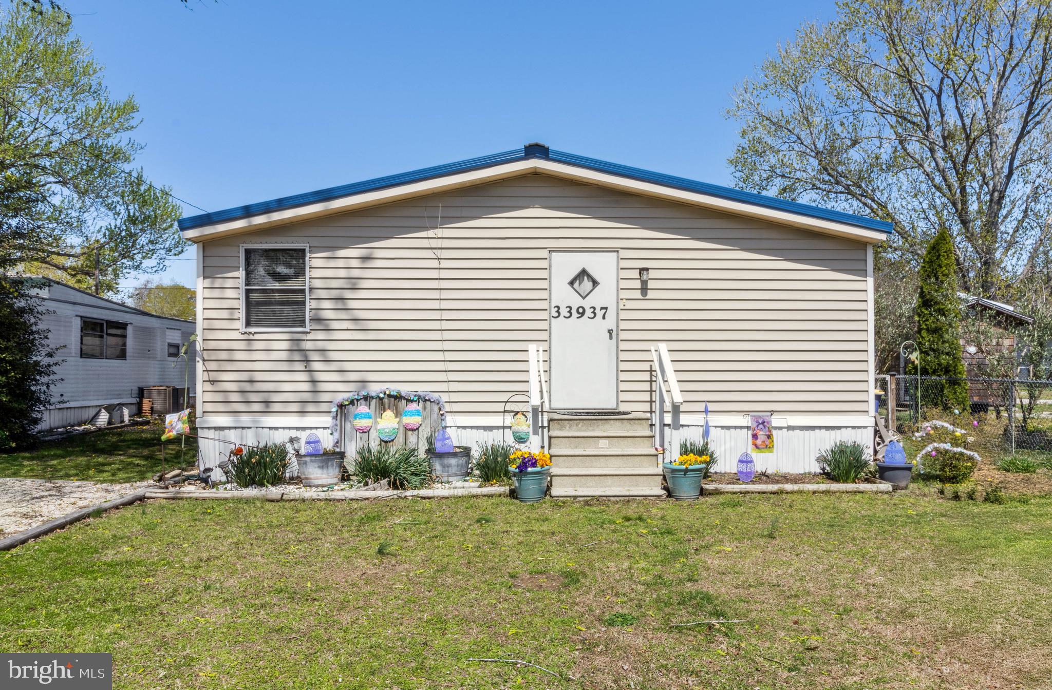 Welcome to your coastal retreat in the marina community of Love Creek! This well-maintained home features a spacious split floor plan with 3 bedrooms and 2 bathrooms, perfect for year-round living or a weekend getaway. Monthly lot rent includes sewer and trash service for easy, low-maintenance living.

Located just moments from the marina, enjoy convenient access to boating, fishing, and crabbing. Inside, the spacious living room offers a comfortable gathering space, while both guest bedrooms feature oversized walk-in closets. The primary suite provides generous storage and comfort.

Recent updates include a metal roof installed in 2022 with a 40-year transferable warranty, a newer electric hot water heater, and updated ceiling fans in the kitchen and living room. Enjoy relaxed coastal living in this charming marina community home.