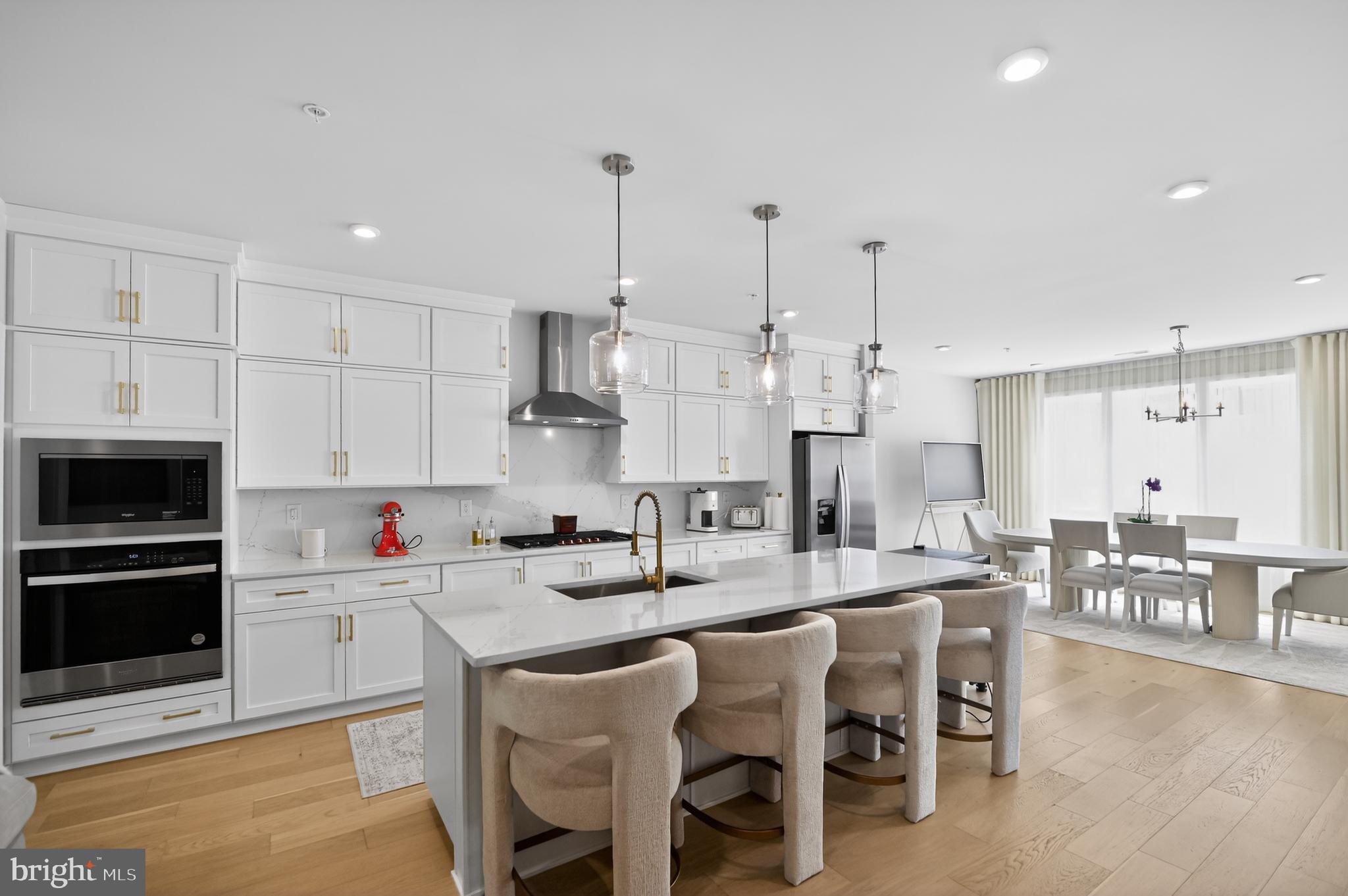 Experience elevated living in Metro Walk with this exceptional Walney floorplan, where refined design meets unmatched convenience in the heart of Ashburn. Offering 3 bedrooms, 2 full baths, a powder room, and a 1-car rear-load garage with driveway parking, this beautifully upgraded residence delivers the perfect blend of luxury, comfort, and modern style.
The sun-filled main living level is designed for effortless entertaining, featuring an open-concept layout anchored by a stunning chef-inspired kitchen with white shaker cabinetry, upgraded quartz countertops, designer backsplash, step-in pantry, and expansive dining area. A dedicated home office provides the ideal space for remote work, while the spacious great room opens to a covered deck, creating seamless indoor-outdoor living.
Retreat upstairs to the luxurious primary suite, complete with a spa-like bath highlighted by a freestanding soaking tub, elegant finishes, and generous closet space. Two additional bedrooms, a full bath, and a conveniently located laundry room complete the upper level.
Crowning this remarkable home is a private rooftop terrace—your own outdoor oasis for morning coffee, sunset cocktails, or entertaining under the stars.
Residents enjoy Metro Walk's premier resort-style amenities, including a clubhouse, state-of-the-art fitness center, zero-entry pool, strolling and biking trails, parks, and community gathering spaces. Just moments from the Ashburn Metro Station, shopping, dining, and major commuter routes, this home offers a lifestyle of luxury, connectivity, and convenience.
A rare opportunity to own one of Metro Walk's most desirable floorplans in a location that truly has it all.
This home offers convenient access to shopping, dining, parks, and major commuter routes. Residents enjoy a well-established community atmosphere, highly regarded schools, and proximity to the many amenities that make Ashburn one of Northern Virginia's most desirable places to live. The nearby Silver Line Metro provides easy access to the greater Washington, DC area, while Washington Dulles Airport is just a short drive away, making travel and commuting exceptionally convenient. Buyer to verify installation and status of retrofitted roof top gazebo. Seller does not guarantee.