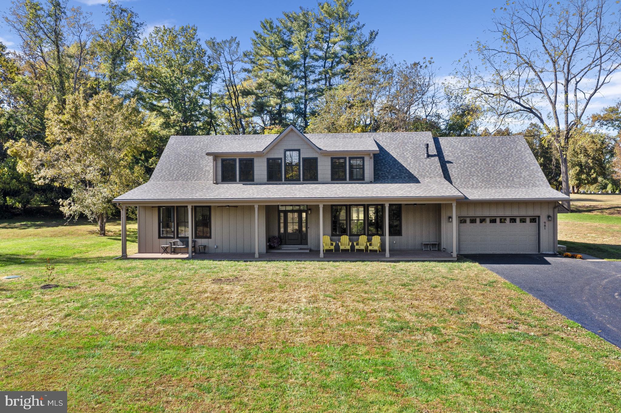 Set on a private 2-acre lot in desirable Birmingham Township and located within the award-winning Unionville-Chadds Ford School District, this exceptional Cape Cod residence offers refined living in a serene setting. The original home was taken down to the foundation and completely rebuilt, blending timeless style with modern luxury and an open, easy-living floor plan. A large covered front porch welcomes you into the foyer, where the expansive open layout immediately impresses. The large windows flood the home with an abundance of natural light and usher in the beautiful views.  The custom chef’s kitchen features bespoke cabinetry, high-end appliances, and a generous center island with seating, seamlessly flowing into the spacious family room highlighted by a slate gas fireplace—ideal for both everyday living and entertaining. The main level is anchored by a luxurious primary suite, offering a spacious bedroom, a modern spa-inspired bath with a large walk-in shower and dual-sink vanity, and separate his-and-hers walk-in closets. A mudroom with laundry and informal powder room provides access to the attached two-car garage, while a private office and formal powder room complete the first floor. Upstairs, French doors lead to a comfortable living area, three well-appointed bedrooms, and a full guest bath. One bedroom includes a large semi-finished attic space, offering excellent storage or future expansion potential. The unfinished walk-out lower level provides abundant additional storage. Outdoor living is equally inviting, with a rear patio overlooking the surrounding natural landscape and stunning vista views. The property is further enhanced by two detached garages—one two-car and one one-car—ideal for additional vehicles, hobbies, or storage. Additional features include engineered wood siding (LP SmartSide siding), spray foam insulation, Marvin Elevate Windows, all PEX plumbing and top-of-the-line appliances. This private oasis offers peaceful seclusion while remaining conveniently close to Route 202, West Chester, Wilmington, and all the amenities the area has to offer.
