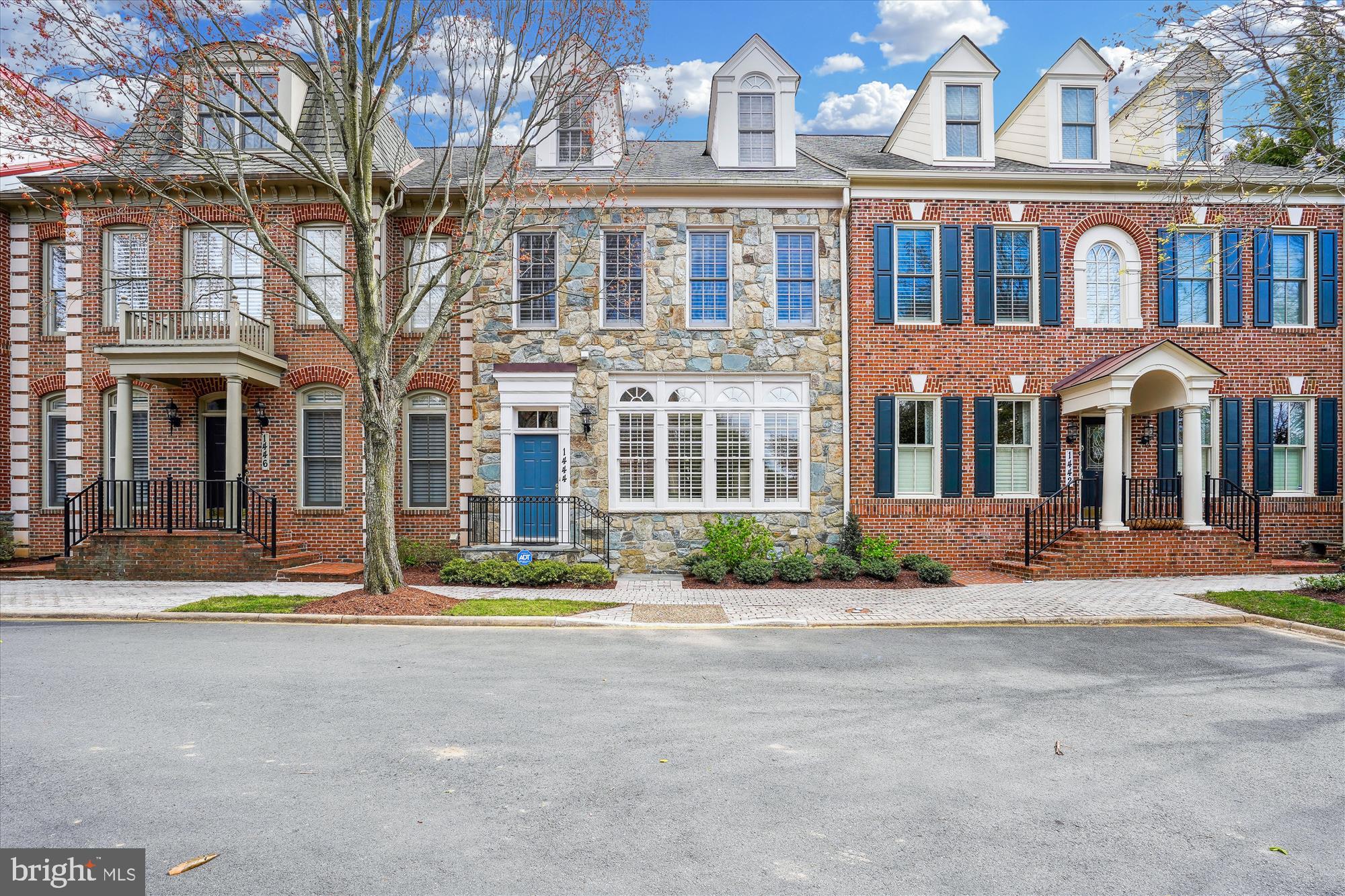 The roof was replaced 2 years ago with a 50 year architectural shingle!  This elegant, elevator-ready, 4-level townhome in Evans Farm with 4,589 finished square feet,  features an open, airy layout with 4 bedrooms, 3 full baths, and 2 half baths. Boasting generously proportioned rooms and floor-to-ceiling windows, the spacious living room seamlessly passes through to the dining room, creating a flowing layout that is ideal for entertaining.  The architect took advantage of angles to highlight the beautiful hardwood floors and elegant crown molding throughout. The eat-in gourmet kitchen is a chef's dream, featuring stainless steel appliances, granite countertops, abundant cabinet space, and a convenient layout that is perfect for cooking and entertaining.The adjacent family room is an inviting place to relax, with a cozy fireplace and a full wall of windows that overlook and segway nicely into  the private courtyard with its indoor-outdoor living space, ideal for enjoying the beautiful weather and entertaining guests.

The upper level includes three spacious bedrooms, including a luxurious primary suite with a gas fireplace in the sitting area, 2 walk-in closets, and an en-suite, over-sized primary bathroom with a soaking tub and separate shower. There are an additional 2 large bedrooms and 1 bathroom on this level.  The laundry room is also conveniently accessed on the second floor.
 
The top level offers the 4th bedroom and bathroom, which can also be used as an office, craft room, or playroom.

The lower level of this home offers much more to discover, including a spacious recreation room.  Divided into a large sitting area and craft area, you will discover matching hardwood entertainment and deluxe cocktail bars, replete with granite counters and offering a mini-fridge and separate wine refrigerator.  Additionally, a separate room is available for a home gym with an adjacent half bath.  Overall this level provides even more space to spread out for leisure or for more formal family gatherings. 
 
Quietly located near the crest of a hill in Evans Farm, with easy access to major highways and popular restaurants and theater, you will find the best life has to offer in this magnificent home. Evans Farm is a classic neighborhood featuring community events throughout the year exclusively for its residents. Welcome and enjoy!