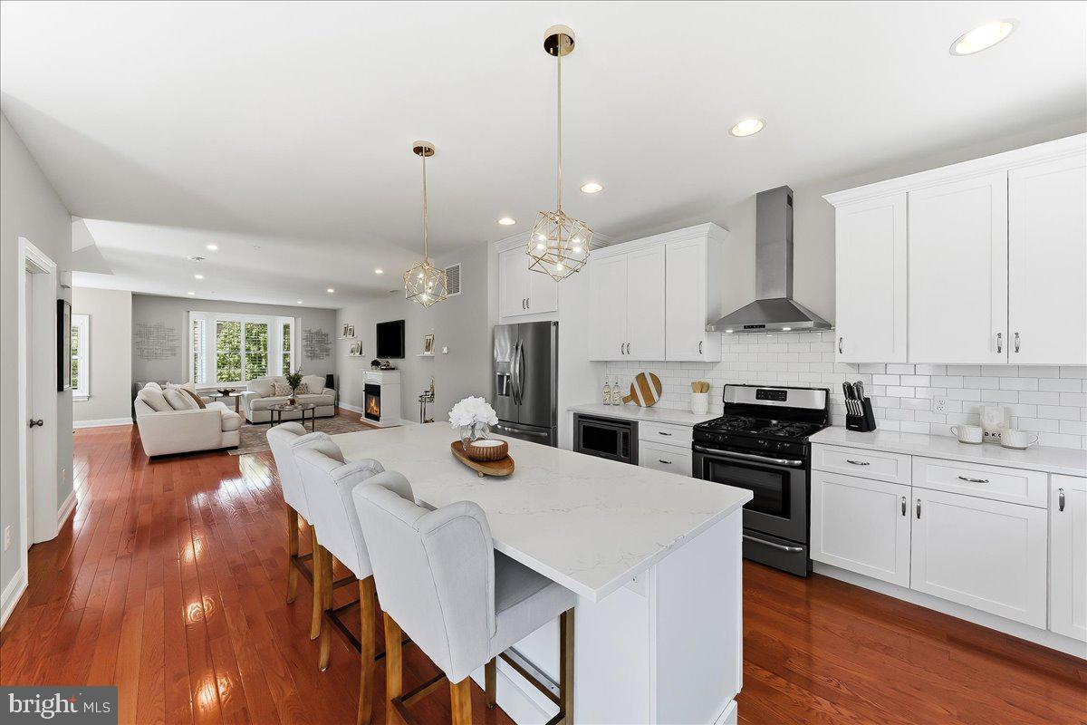 Built in 2017, this brick and vinyl home is one of the few new/newer homes in the borough. Another desirable feature is the attached two-car garage AND an additional, assigned parking space, giving you convenience that most borough homes simply don’t have. A West Chester Borough twin with sunny southern exposure puts you in the middle of it all, with true walkability to everything the borough has to offer, from restaurants and coffee shops to parks and everyday essentials, and West Chester University.** Inside the front door, a wide staircase with oak treads and abundant windows with interior shutters are among the luxury features evident throughout the home. The first floor provides an entry from the front door and from the garage. This flex room can provide its new owner with a variety of functions, from gym, to office, to gaming room. There is also access to the basement from this room and a generous coat closet. The living level is filled with natural light due to its southern exposure. The kitchen and deck get the morning light, and the family room gets the sunset. The living area is anchored by a fireplace, creating a comfortable focal point, while the kitchen—finished with quartz countertops—flows easily into the dining area for both daily living and entertaining. This stainless steel refrigerator is included in the sale. 
The bedroom level includes a primary suite with a generous walk-in closet. The primary bathroom includes frameless shower doors around a large walk-in shower, and furniture grade double vanity.  The bedroom level also includes two guests rooms, a hall bath, a laundry area including washer and dryer, and linen closet.**The unfinished basement provides excellent storage now, with egress that offers the opportunity to finish and expand your living space over time.**The Peloton and inversion table are also available for sale.**If your life takes you outside the boro, you have quick access to Routes US-202, PA-3, US-322, PA-100, and PA-52. Exton Amtrak/SEPTA is 10-15 minutes drive depending on traffic. 3 SEPTA bus routes run through the Boro (92, 104, 135). School feeder is Bayard Rustin HS, Stetson MS, and Westtown-Thornbury ES.