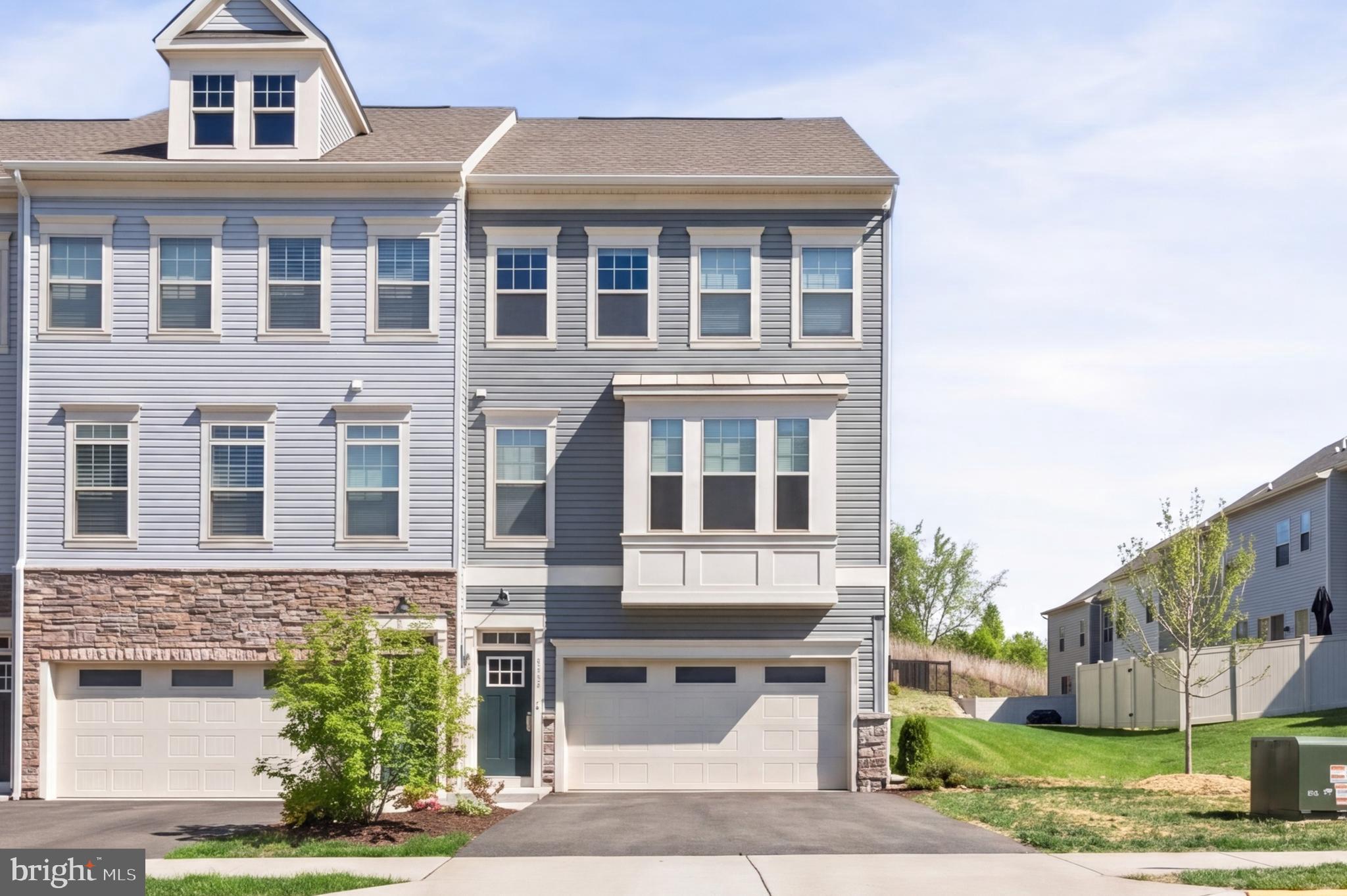 Welcome to 1210 Creek Bank Dr, where modern comfort, stylish finishes, and flexible living spaces come together in Stafford’s sought-after Whitson Woods community. This beautifully designed end-unit townhome offers the perfect blend of low-maintenance living and thoughtfully crafted interior spaces, all within close proximity to shopping, dining, commuter routes, and everyday conveniences.

Filled with natural light and designed for today’s lifestyle, the main living level features an open-concept layout with Luxury Vinyl Plank flooring and seamless flow between the living room, dining area, and kitchen. The kitchen is both functional and inviting with quartz countertops, white cabinetry, stainless steel appliances, a spacious center island, and generous table space—creating an ideal setting for everyday living, casual mornings, or entertaining friends and family.

The upper level provides a comfortable retreat highlighted by a spacious primary suite with a walk-in closet and a private bath featuring tile flooring, a stand-alone shower, and tiled shower surrounds. Two additional bedrooms and another full bath offer versatility for guests, work-from-home needs, or changing household dynamics.

The entry level expands the home’s flexibility even further with a private fourth bedroom and full bath, perfectly suited for guests, a home office, fitness room, or multi-generational living arrangements. A 2-car attached garage adds convenience and additional storage space.

As an end-unit property, the home enjoys additional windows and enhanced natural light, creating a bright and welcoming atmosphere throughout all three levels. Combining modern finishes, functional design, and an ideal Stafford location, this move-in ready home offers the space, style, and convenience buyers have been waiting for.