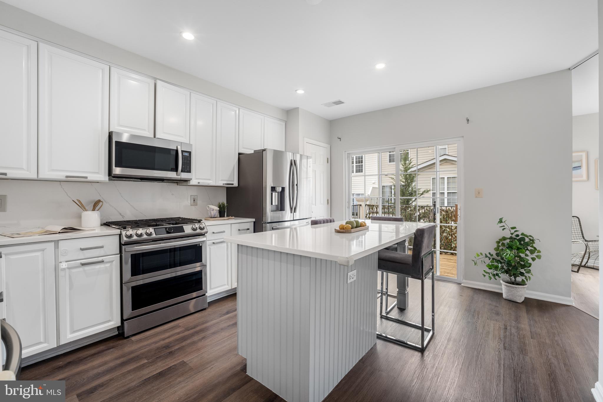 Offer deadline is 5:00 PM on Monday, March 31, 2025. Welcome to this charming 2-bedroom, 2.5-bathroom condo with a dedicated office, located in the peaceful and desirable Westwood Village community! This end-unit home is filled with natural light and modern updates throughout.                                                                                                                                                                                                                                 
                                                                                                                                                                                                                                      
The main level features a spacious eat-in kitchen with a large island, all quartz countertops and stainless steel appliances  (2021), and direct access to a private patio—perfect for relaxing or dining outdoors. The kitchen was remodeled  in 2021, making it both stylish and functional. The dining area and family room are open and inviting, perfect for everyday living and entertaining. A separate office offers a quiet space for work, study, or hobbies.                                                                                                                                                                     
                                                                                                                                                                                                                          
Upstairs, the primary suite is a peaceful retreat with a walk-in closet that has three windows and a custom closet system (2022). The ensuite bath includes a separate shower and soaking tub. The second bedroom also features a walk-in closet and its own full bath, providing privacy and convenience.                                     
                                                                                                                                                                                                                                     This home has been meticulously updated with new flooring (2022), a new HVAC system (2023), and fresh paint (2025). The laundry area is conveniently located on the upper level, and the end-unit location adds extra privacy and natural light.                                                                                                                                                  
                                                                                                                                                                                                                      
Westwood Village offers a gated community with an outdoor pool, fitness center, and beautifully landscaped streets lined with cherry blossoms and crape myrtles. The location is fantastic, with a short walk to the Silver Line Metro-Spring Hill stop.  Shopping , dining and the soon to be completed Tysons Community Center just steps away.   You’ll have easy access to I-495, Route 7, and Tysons Corner.  Don’t miss out on this opportunity—schedule your tour today!