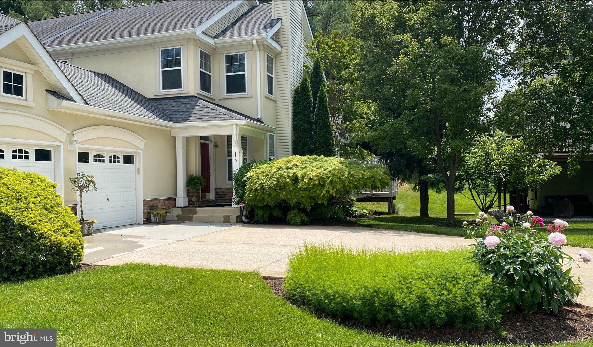 Welcome to this rarely available  end of group town home on a large wooded lot in Avalon East! 
This semi custom home features 4 bedrooms and 3.5 baths, The primary bedroom ensuite located on the main level adds ease and comfort with soaking tub, separate shower and custom walk in closet .  You will enjoy all the natural light in the living room and dining room with gleaming hardwood floors, wood burning fireplace and  2 story ceilings! In addition there is a exquisite custom designed  library area, display niches  for art and recessed lighting throughout the house. The spacious kitchen features glass front
 cabinets , built in table seating and french doors to a large and private trex deck. The second floor has a wrap balcony over looking the living room, 2 bedrooms and a full bath.  The fully finished lower level expands your options with additional living area, rec room, 4th bedroom, full bath, laundry and additional storage spaces.
You will appreciate the convenience of a 2 CAR GARAGE  and driveway parking!
Residents also enjoy the tennis/sports courts, swimming pool, club house and walking paths.
This community is very convenient to I695, great shopping, to include Trader Joes, Wegmans and  many restaurants! 
This home truly offers the perfect blend of comfort, space and location!