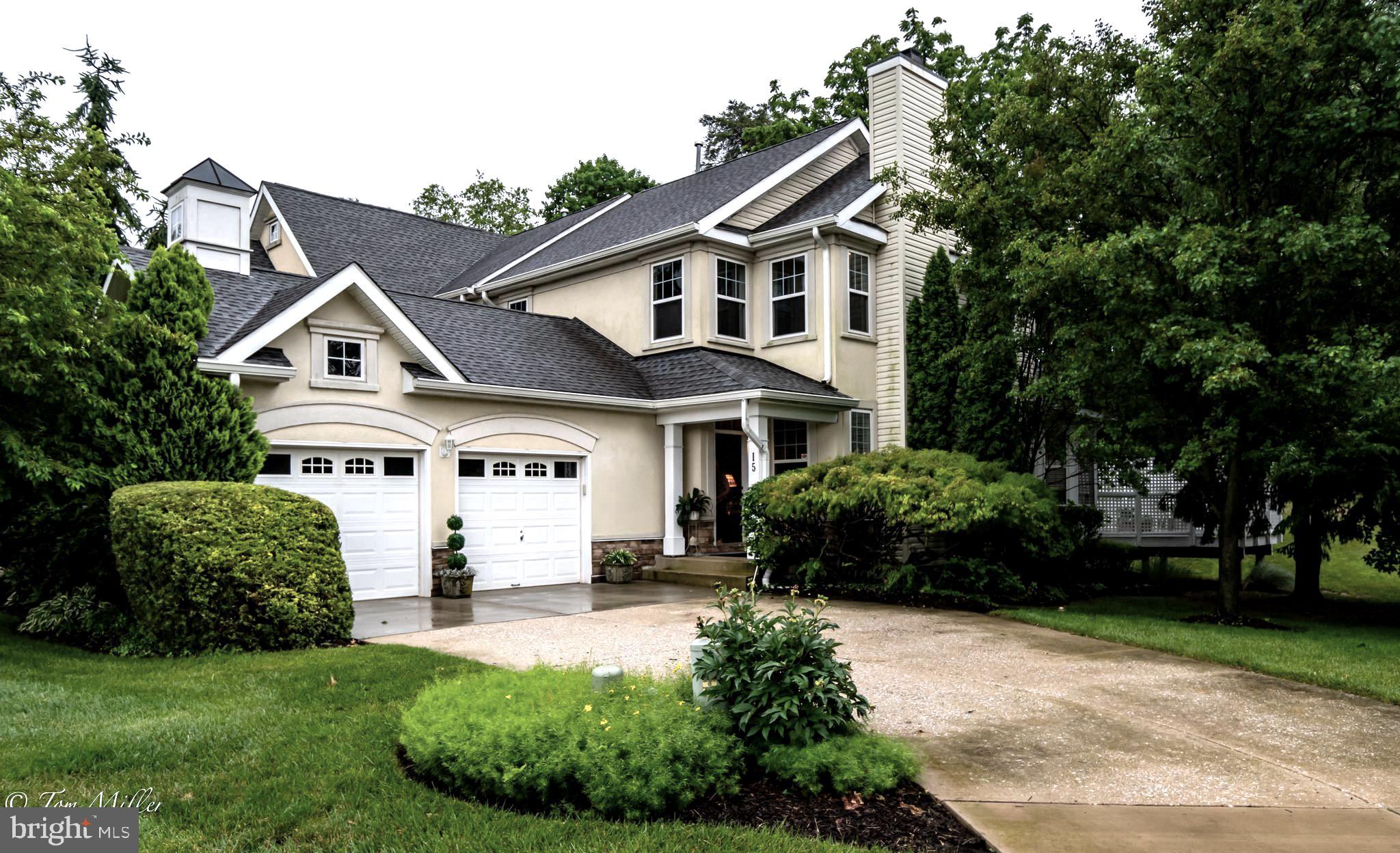 Welcome to this rarely available  end of group town home on a large wooded lot in Avalon East! 
This semi custom home features 4 bedrooms and 3.5 baths, The primary bedroom ensuite located on the main level adds ease and comfort with soaking tub, separate shower and custom walk in closet .  You will enjoy all the natural light in the living room and dining room with gleaming hardwood floors, wood burning fireplace and  2 story ceilings! In addition there is a exquisite custom designed  library area, display niches  for art and recessed lighting throughout the house. The spacious kitchen features glass front
 cabinets , built in table seating and french doors to a large and private trex deck. The second floor has a wrap balcony over looking the living room, 2 bedrooms and a full bath.  The fully finished lower level expands your options with additional living area, rec room, 4th bedroom, full bath, laundry and additional storage spaces.
You will appreciate the convenience of a 2 CAR GARAGE  and driveway parking!
Residents also enjoy the tennis/sports courts, swimming pool, club house and walking paths.
This community is very convenient to I695, great shopping, to include Woodholme, Wegmans and restaurants! 
This home truly offers the perfect blend of comfort, space and location!