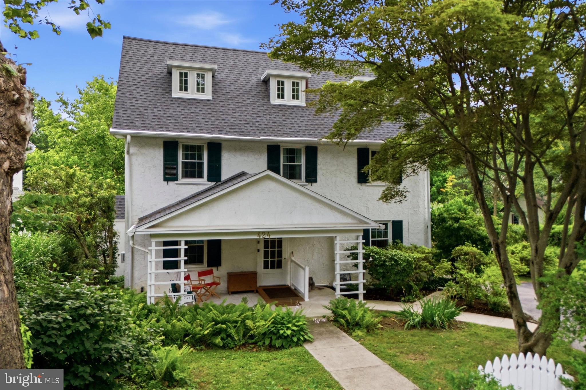 Situated on an extra-wide lot in the heart of Narberth, 424 Haverford Avenue seamlessly blends timeless character with thoughtful updates, offering exceptional indoor and outdoor living in one of Lower Merion Township's most sought-after neighborhoods!

A welcoming front porch leads into the center hall foyer, complete with a convenient coat closet and beautiful hardwood floors that continue throughout the home. Glass French doors open to the spacious living room, highlighted by a classic wood-burning brick fireplace and the added convenience of a full bathroom with a walk-in shower. The formal dining room features a charming bay window and ceiling fan, creating the perfect setting for everyday meals or entertaining. Just beyond, a conveniently located powder room leads to the well laid out kitchen, thoughtfully designed with a center island and sink, stainless steel refrigerator, gas range, stainless steel dishwasher, dedicated eat-in area, and a built-in office/desk space ideal for working from home or managing daily tasks.

Step outside to the rear deck overlooking a private backyard oasis complete with a swimming pool, beautifully landscaped gardens, and generous yard space—perfect for relaxing, entertaining, or enjoying warm summer days.

The second floor offers a spacious primary bedroom featuring a wood-burning brick fireplace and two closets. An adjoining bedroom with custom shelving provides flexibility as a nursery, home office, or dressing room. An additional bedroom with painted wood floors and a large closet, a generous hall linen closet, and a full hall bathroom with a tub/shower combination complete this level.

The third floor adds even more versatility with two additional bedrooms, including one with a convenient laundry area tucked into the dormer, along with another full hall bathroom featuring a tub/shower combination.

The unfinished basement offers abundant storage space and includes an exterior access door for added convenience. 

Additional improvements in the home include a newer roof (less than five years old), replacement windows, and a newer sewer line, providing peace of mind for years to come.

Enjoy the best of Narberth living, within walking distance from restaurants, shopping, parks, the SEPTA train station, and all the amenities that make this vibrant community so desirable. This is a rare opportunity to own a character-filled home with generous living space, exceptional outdoor amenities, and an unbeatable location in award-winning Lower Merion Township.