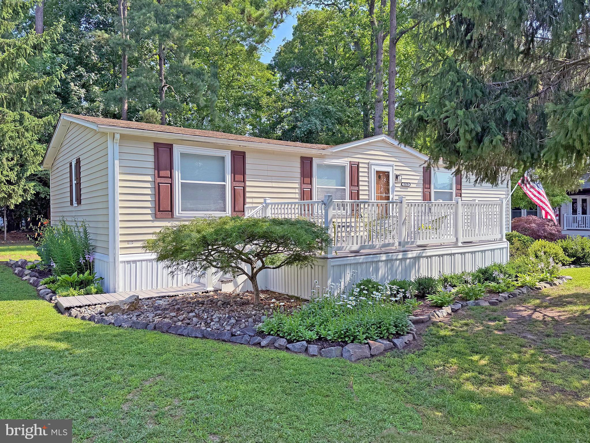 Back on the Market through no fault of the Seller. Rehoboth Bay Community has boat slips for rent, a community boat ramp, a boat/PWC storage area, a Bay-front pool, a crabbing/fishing pier, a little beach, tennis/pickleball courts & more! And it is just 6.5 miles to the famous Rehoboth boardwalk. 2013 E-Z Go Golf Cart with newer 10-Year (2024) Battery included with a Full Price Offer ($5,000 value). Beautifully updated Santa Fe doublewide home has a 12’x20’ 4-season sunroom for +1,400 sq. ft. of living space. Luxury vinyl plank flooring throughout. The home’s living room has vaulted ceilings and adjoins an area that would be perfect for a formal dining room set or as a “sitting room,” as it is currently being used. Spacious kitchen has room for a breakfast dinette set. The kitchen features crisp white cabinetry with hi-def countertops and a pressed-tin backsplash. There’s a center island for extra prep space. The stainless steel appliances include a fridge with ice maker, dishwasher, gas range, and a built-in microwave. There is also a garbage disposal. The laundry area is in the kitchen & has a full-size stacked washer & dryer set. The tankless water heater is also located by the laundry. You are going to love, love, love the sunroom, which has two sliding glass doors and features panoramic views of the backyard. The backyard opens to common grounds, so you’ll enjoy the open space when you are in the sunroom or in the adjoining screened porch. The screened porch has marine-garde vinyl panels for 3-season use, too. Popular split bedroom plan. The main bedroom is en suite with two closets. The other two bedrooms and second full bath are located off the living room hallway. There’s large front deck when you want to watch the neighbors go by, and an expansive boardwalk-style rear patio to enjoy the wooded common grounds behind the home. HVAC pac unit. Outdoor shower for sandy beach days or after salty boat rides. Oversized shed with a loft and electric, and an outlet for charging your golf cart. Yes: Golf carts are allowed in Rehoboth Bay! Central AC and gas (LP) furnace. The community also allows 2 pets (no fences, though). Leasehold Interest: Lot Rent of approx. $778.39/mt. includes water service & trash/recycle. (Delaware law caps rent increases as per 25 Del. C. Sec. 7050-7054 with Lease renewals on Jan. 1 for this home). Homeowner pays electric, fuel, sewer, cable/Internet, and lawn maintenance. Hometown America, the community owner, requires an Application from the Buyer (and all adult occupants 18-year-of-age or older), with acceptance based on the following criteria: 1.)income verification, 2.)credit bureau score, plus evaluation of debt-to-income ratio, and 3.)criminal background check. (Note: Family & friends may always visit, but short-term rentals are NOT permitted in this community.) Financing may be available to qualified borrowers from only a few Lenders that specialize in installment/chattel loans for manufactured homes on leased land. Closing costs will include a real estate transfer tax (3.75% DMV Doc Fee) & a Settlement Agent fee.