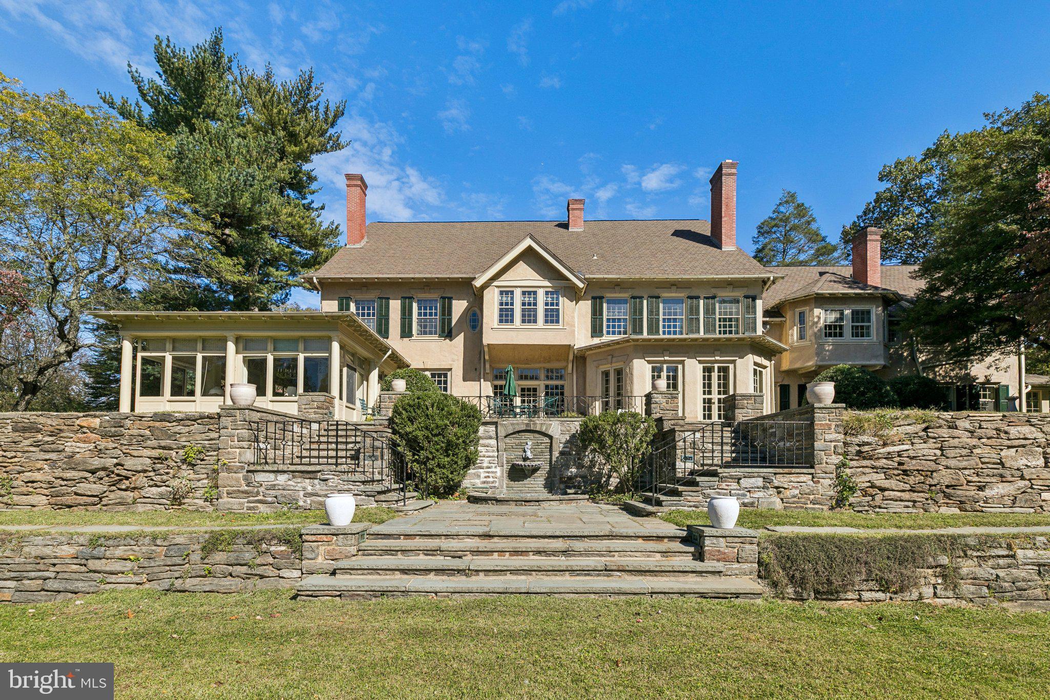 A GILDED AGE LEGACY: CAENAWON, A 10,000+ SQ FT COLONIAL REVIVAL ESTATE ON 2.8 ACRES

A singular opportunity to acquire a landmark estate of unparalleled architectural pedigree. Built c. 1903-1910 and designed by the esteemed Philadelphia firm Duhring, Okie & Ziegler for financier Edgar W. Baird, "Caenawon" presides over 2.8 magnificent, elevated acres in the heart of Chestnut Hill.

This 10,000+ sq ft residence is a true architectural time capsule, a celebrated part of Chestnut Hill’s historic fabric. It has been meticulously cared for, is offered in robust, move-in-ready condition following its post-1970 refresh, and is ready for its next steward to define its future. The home is eligible for the National Register of Historic Places, offering the potential for designation at the new owner's discretion.

ARCHITECTURAL GRANDEUR AND INTERIOR AMENITIES

The interior showcases the scale and superior craftsmanship of the Gilded Age.

Architectural Hallmarks: The home features a Library, a signature design element of the architects, which serves beautifully as a casual gathering space or modern retreat.

13 Fireplaces: A remarkable collection of 13 original fireplaces creates warmth and focal points throughout, highlighted by a striking, matched pair in the grand living room.

Design for Entertaining: The home was conceived with large-scale entertaining at its heart, featuring ample service areas, and a charming, rare dedicated flower cutting room just off the side entrance.

Daily Living: Complementing the formal dining room is a quiet breakfast room just off the kitchen for informal, everyday meals.

Bedrooms: The main level is currently configured with 6 bedrooms, including a flexible primary suite with an attached sitting room, plus a desirable den/study located at the opposite end of the bedroom floor for maximum privacy.

THE 2.8 ACRE PRIVATE GROUNDS

The exquisite grounds are a layered masterpiece designed for both relaxation and entertaining.

Terraced Landscaping: The 2.8 acre plot features gracefully terraced land, secured by stunning original stone bracing walls at each level.

Water Features: The setting is accented by two small, charming fountains located at each terraced tier, offering future potential for restoration.

Pool & Patios: Outdoor entertaining centers on a lovely swimming pool draped in mature wisteria. A flagstone surround and a generous brick patio provide seamless access from the sunroom, foyer, and dining room.

Vintage Amenities: The lower level includes a full suite of vintage amenities: an old-fashioned, rudimentary wine cellar with a locked door, ample storage, and dedicated ladies’ and gentlemen’s changing rooms/full baths conveniently located for pool access. A detached two-car garage completes the offering.

LOCATION AND LIFESTYLE

Caenawon offers the ultimate Chestnut Hill lifestyle:

Commuter Convenience: The home is just 50 yards from the Highland Station of the Chestnut Hill West SEPTA line, providing direct access to Center City and beyond.

Village Access: Enjoy proximity to all that Germantown Avenue has to offer, including local favorites like CinCin, El Poquito, Cake, Bredenbeck's Bakery, Killian's Hardware, Matines Cafe, and Char & Stave Coffee.

Nature at Your Doorstep: Enjoy unparalleled access to nature with trailheads at the base of Rex Avenue, leading directly into the scenic Wissahickon Trails and Valley Green.

Define the next chapter of a Philadelphia architectural landmark!