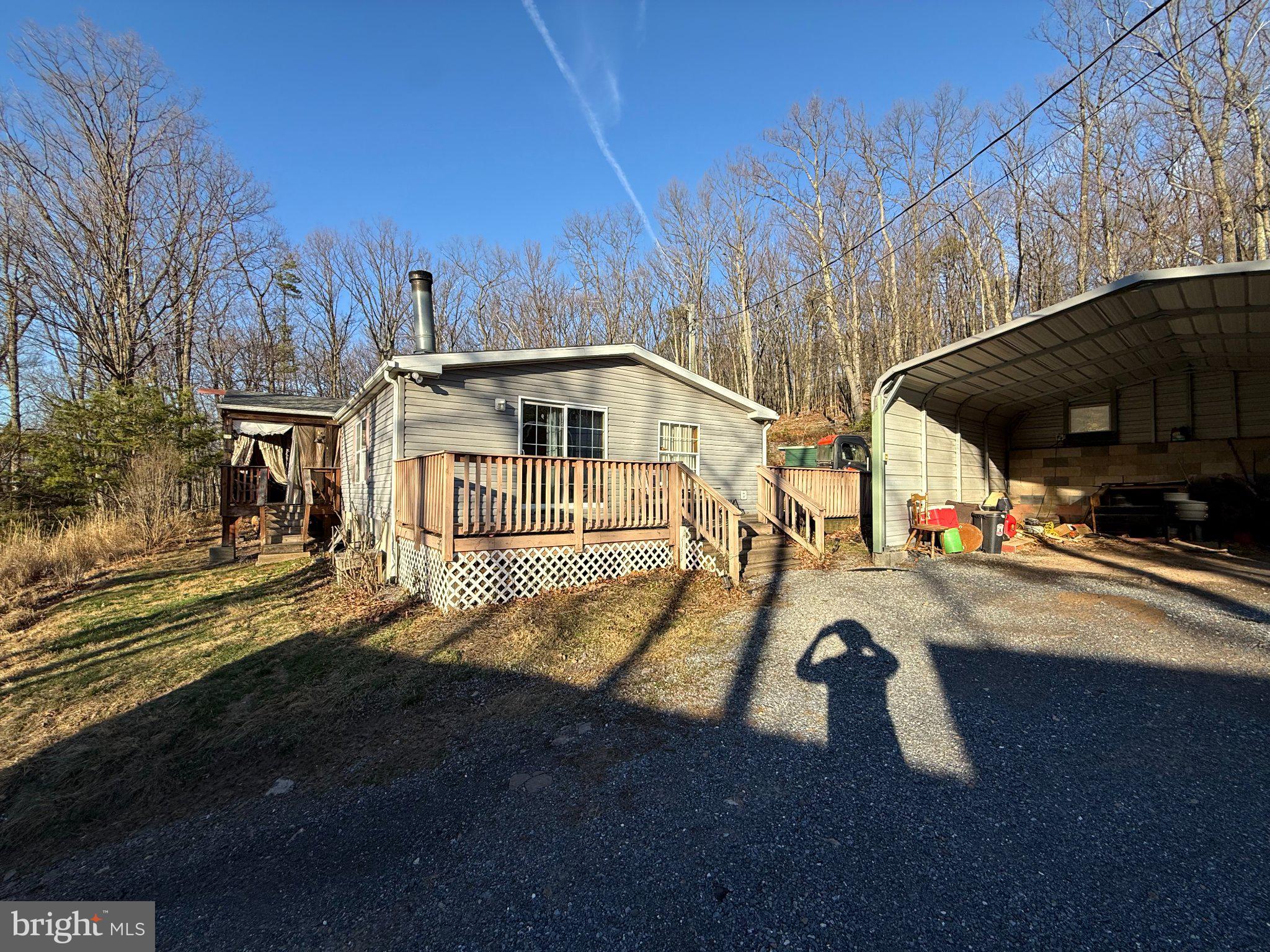 Discover the perfect blend of privacy, nature, and opportunity at 37 Advent Dr. Nestled in a peaceful setting with easy access to outdoor recreation, this property offers a rare chance to create your ideal mountain retreat.

Just minutes away, Short Mountain’s 8,000+ acres of state land provide endless opportunities for hiking, hunting, and exploring—perfect for outdoor enthusiasts. Within the community, residents enjoy access to a bath house and community pond, adding to the relaxed, getaway-style atmosphere.

The property includes outbuildings, offering additional storage, workspace, or potential for future use. Additional lots are currently available just down the road, some bordering Short Mountain, highlighting the area’s growing appeal. Both the subject property and nearby parcels offer easy access to the mountain and surrounding natural amenities.

Home needs work and is priced accordingly—sellers are open to offers, making this a great opportunity for investors, renovators, or buyers looking to build equity.

House next door may offer a potential right of first refusal, presenting a unique opportunity for expansion or long-term investment in this desirable location.