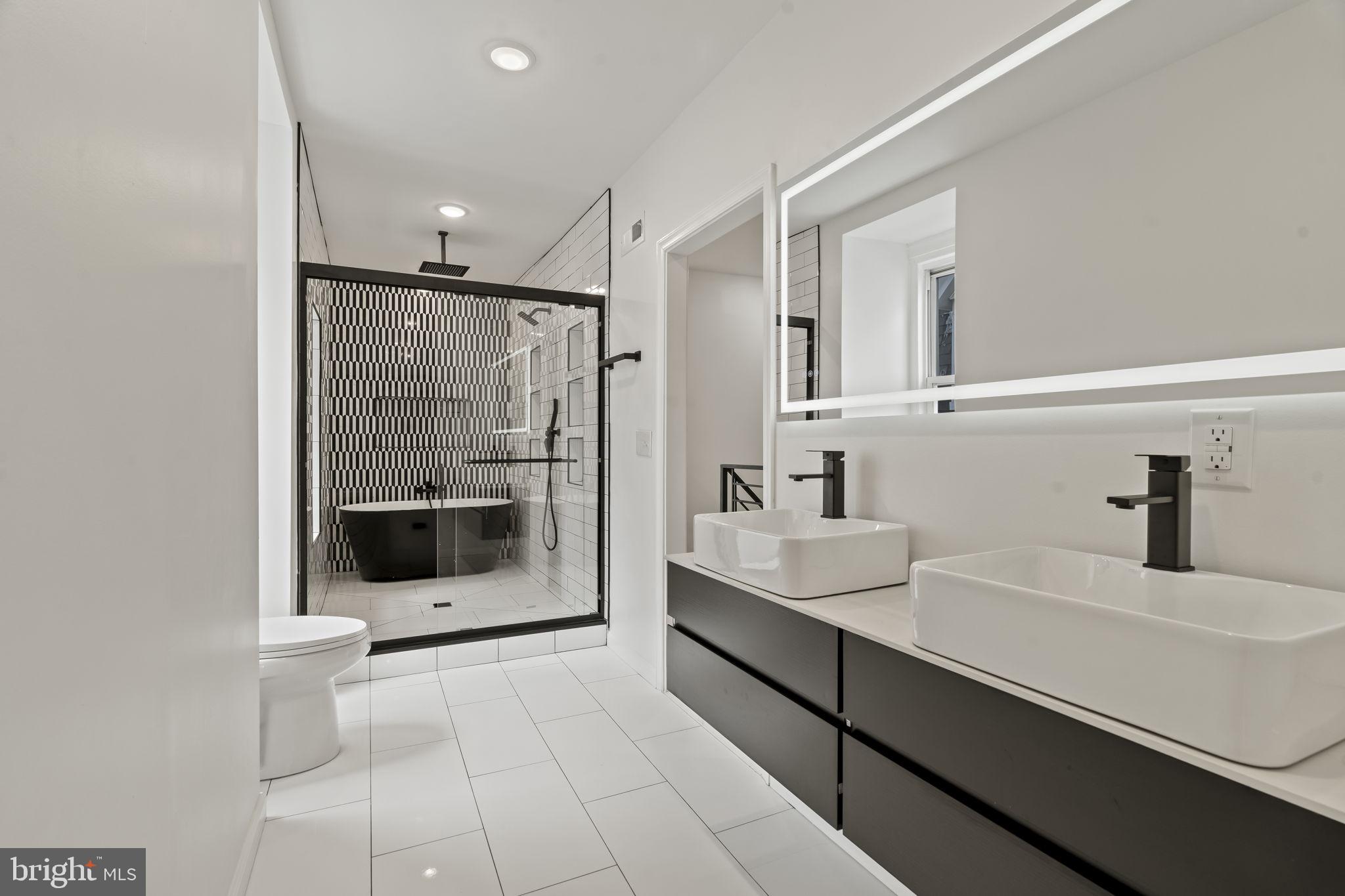 Welcome to this fully renovated Victorian twin offering exceptional space, modern luxury, and flexible living. The top level includes is a private master suite with a custom spa-style bath and large walk-in closet, as well as an additional bedroom/office/gym. The second level features 2 custom bathrooms and three bedrooms with designer finishes throughout.

A one-of-a-kind kitchen anchors the first floor, featuring custom cabinetry, premium countertops, and stainless steel appliances, flowing into a private rear yard ideal for entertaining. Additional highlights include in-home laundry, central air and HVAC, and a comprehensive renovation for true move-in-ready living.

Ideally located near Germantown Ave eateries, cafes, and amenities, with easy access to Center City, transit, and parks.

Rare size, condition, and layout at this price point. Schedule your showing today