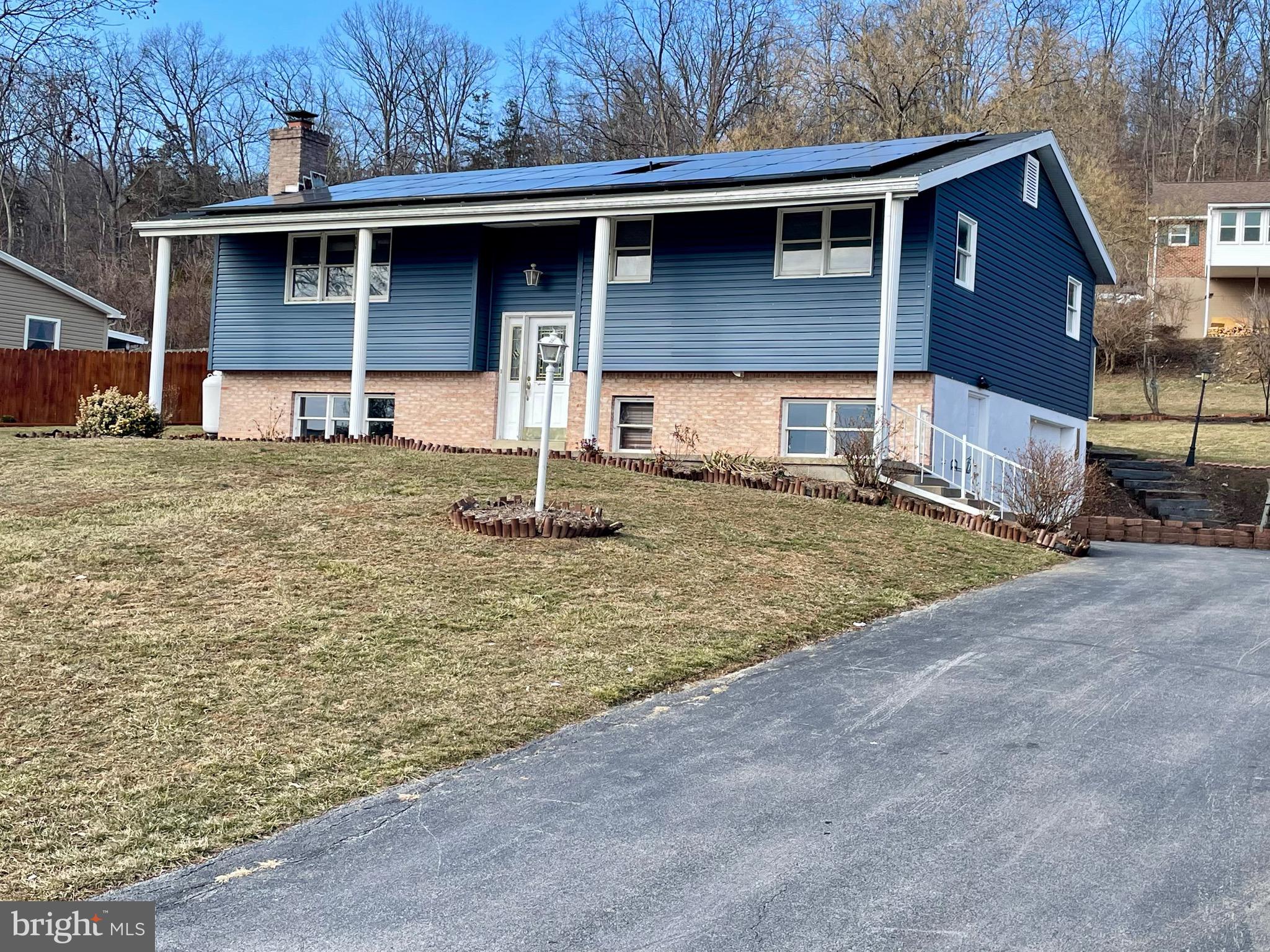 Home is located in a desirable development - lovely Pleasant Acres.  Walkable to Mifflin County high school and Mifflin County Junior High. Very close to Lewistown hospital as well. Just minutes from 322, approx 25 miles to State College.  3 bedrooms & full remodeled bath on main level - family room & half bath on lower level (could be fourth bedroom) Laundry hook ups on both levels.  1 car integral garage.  Newer siding, roof & rear covered deck all in 2023 & new 10x20 shed in 2024. Water heater new in 2022.   **This home has RENU solar panels that assist with electric expense. Contract / loan is transferable with approval. Copy of electric bills, monthly solar panel payment and contract information / terms available on request. Move in immediately.  Natural gas lines recently added to the development - opens up more heating / cooling options.  Recent survey done.