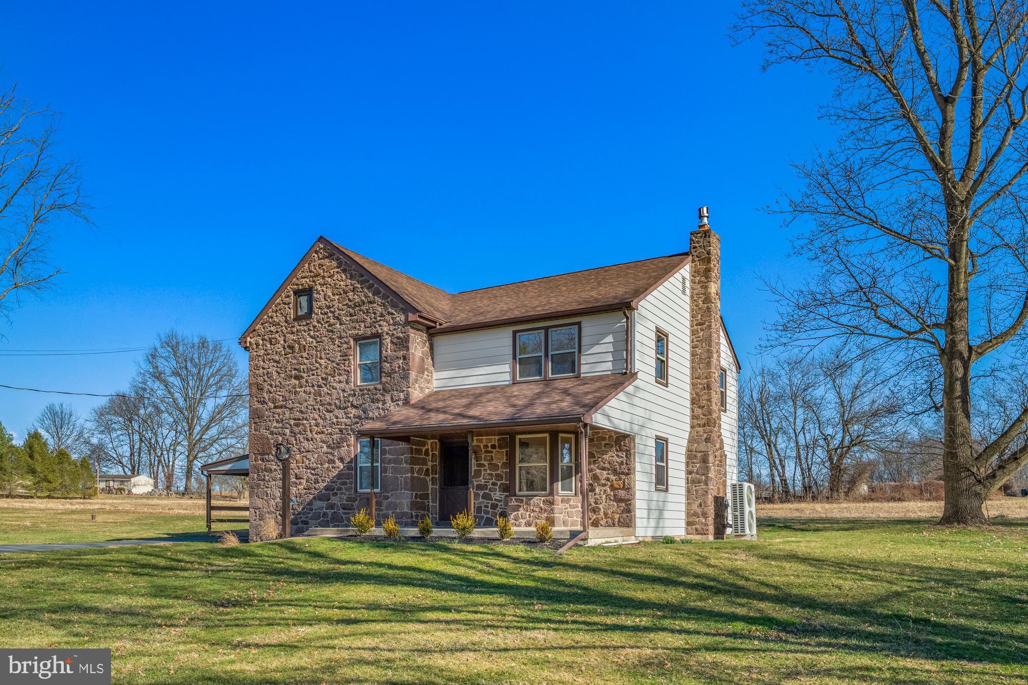 Set on approximately 6.3 peaceful acres in the countryside of Spring City, this charming, nearly 200-year-old farmhouse offers a rare blend of history, character, and thoughtful care. This 3 bedroom, 2 bath  home has been lovingly maintained over the years and feels incredibly solid and well-kept—providing peace of mind while still embracing its original charm.

Inside, you’ll find timeless details like deep-set windows, beautiful stone elements, and portions of original wood flooring that add warmth and authenticity throughout. Fresh paint and new carpet across much of the home make it feel clean, bright, and move-in ready, while a new roof and freshly painted exterior add to its overall appeal.

The property itself is just as special. A stunning, well-maintained bank barn stands as a centerpiece, offering endless possibilities—whether for storage, hobbies, animals, or creative use. The stone bank barn is impeccable and the centerpiece of this homestead; with original wood beams in great condition, showcasing traditional mortise and tenon construction. Additional outbuildings, including a garage and a covered, open barn-style structure ideal for equipment, add even more versatility.

Surrounded by mature trees, the setting is peaceful and private, with multiple covered patio areas perfect for relaxing and enjoying the views. A spacious driveway provides plenty of parking for guests, equipment, or everyday convenience.

Located within the Owen J. Roberts School District, this property offers the opportunity to enjoy country living with room to grow, create, and make it your own—all while owning a piece of local history.