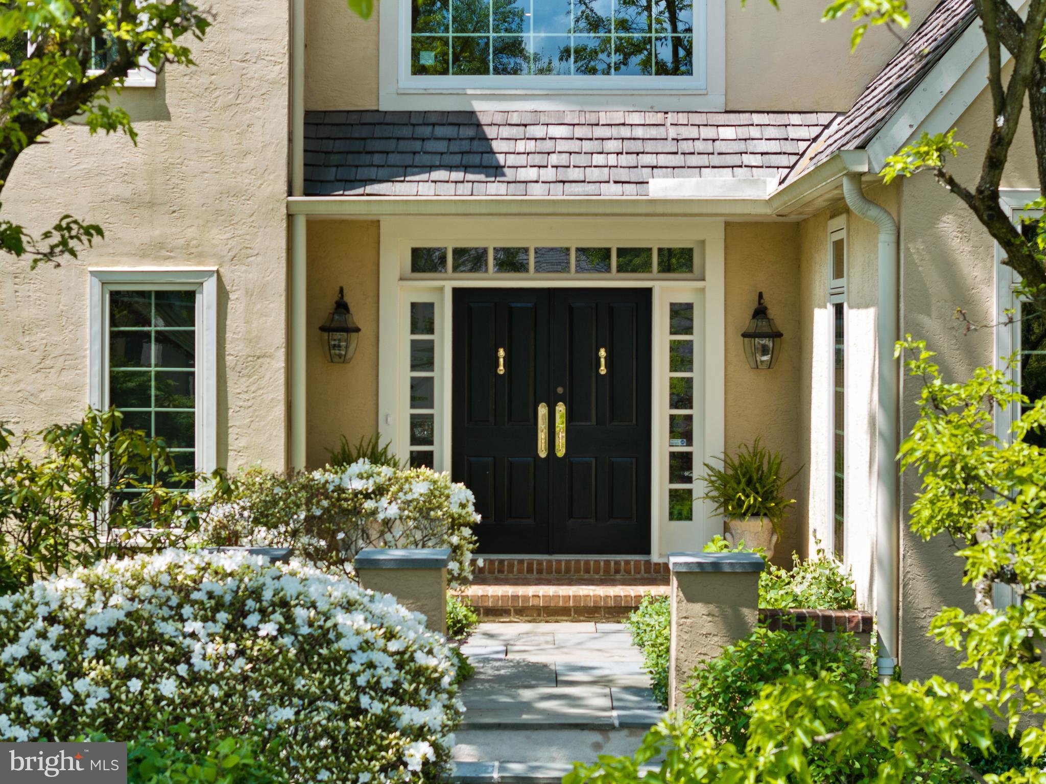 Experience living in this meticulously cared for Denbigh home, nestled within a secluded enclave of about 50 residences. Surrounded by acres of open space with meandering trails, this 3400 sq ft residence offers a serene escape. Step inside to discover the grandeur of the first floor, with a dramatic two-story foyer flooded with natural light. To the right, the library offers a tranquil retreat for work or study, complete with a fireplace and a wet bar. The inviting living room boasts a formal fireplace and is open to the dining room which features two sets of French doors opening to the back patio. The bright kitchen with its dining area provides ample space for entertaining and storage. The family room, with cathedral ceilings, fireplace and French doors overlooking the patio, creates an inviting ambiance, perfect for relaxation. Additionally, the main floor hosts the laundry room and a half bath. Upstairs, the spacious primary suite offers two walk in closets and a  bathroom. Two additional bedrooms and a hall full bathroom finish the second floor. The finished basement also has an unfinished area for storage. The breezeway was enclosed, with two large storage closets, leading to a two car garage. Outside, half walls surround all walkways and the rear patio for privacy. Most windows have been replaced while the surrounding stucco was repaired at that time and the cedar roof has been replaced. Wayne, just minutes away, and King of Prussia's specialty shopping are easily accessible, while being close to all major roadways such as 76, 476, and the PA Turnpike. This residence epitomizes refined living, blending luxury, convenience, and tranquility.
