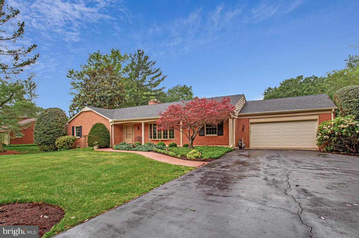 Nestled in the peaceful and highly desirable Dunloggin community, this sprawling custom brick rancher offers comfort, space, and an exceptional location close to top-rated Howard County schools. Designed for both everyday living and effortless entertaining, the heart of the home is the expansive kitchen featuring an adjoining breakfast area with a cozy gas fireplace, all opening to a stunning great room surrounded by walls of windows overlooking the tranquil backyard. Enjoy quiet mornings with coffee or unwind in the evenings on the relaxing screened porch or brick patio while taking in peaceful nature views. Greet visitors on the covered front porch & keep deliveries out of the weather; formal living and dining rooms provide elegant spaces for hosting gatherings and special occasions. The main level also includes three spacious bedrooms, two beautifully renovated bathrooms, convenient main-level laundry, and direct access to the oversized two-car garage. High-quality Renewal by Andersen windows & Pella doors enhance both comfort and efficiency. The walkout lower level offers incredible additional living space, including a bright recreation room with a handsome brick wood-burning fireplace & thoughtful bar/serving area with dishwasher & sink — the perfect setting for casual gatherings and making lasting memories with family and friends. A private den & connected full bath provides a quiet retreat for a home office, guest space, or hobbies. The lower level also features a second laundry area, abundant unfinished storage and workshop space, plus an additional walkout to the backyard for added convenience. New roof & skylight (2020); kitchen double oven / SubZero refrigeration (2023); Jenn-Air gas cooktop (2024); dishwasher (2025); main level Speed Queen washer/dryer (2025); GAS water heater (2018); HVAC system (2012)  Relish in all that this central Ellicott City location has to offer - parks, trails, lakes, restaurants, & shoppes or just stroll around the quiet streets of your new community for exercise & camaraderie with your neighbors.
