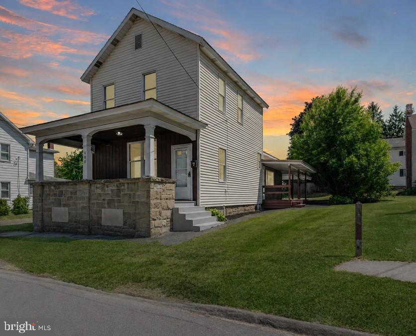 Old-world charm meets modern functionality in this beautifully updated home! From top to bottom, you'll appreciate the thoughtful improvements, including a new bathroom, updated flooring, modern electrical service, a new furnace, stylish countertops, updated appliances, and a stunning farmhouse sink that serves as the centerpiece of the kitchen. Soaring 9-foot ceilings and updated light fixtures enhance the home's bright, welcoming feel, while the spacious eat-in kitchen flows seamlessly into the generous dining and living areas perfect for everyday living and entertaining alike. Enjoy peaceful mornings on the inviting front porch or unwind with dinner on the side porch overlooking the quiet neighborhood setting. Offering three generously sized bedrooms and a blend of character and convenience that's hard to find, this home truly must be seen to be appreciated. Updates, charm, and value come together in one exceptional package!