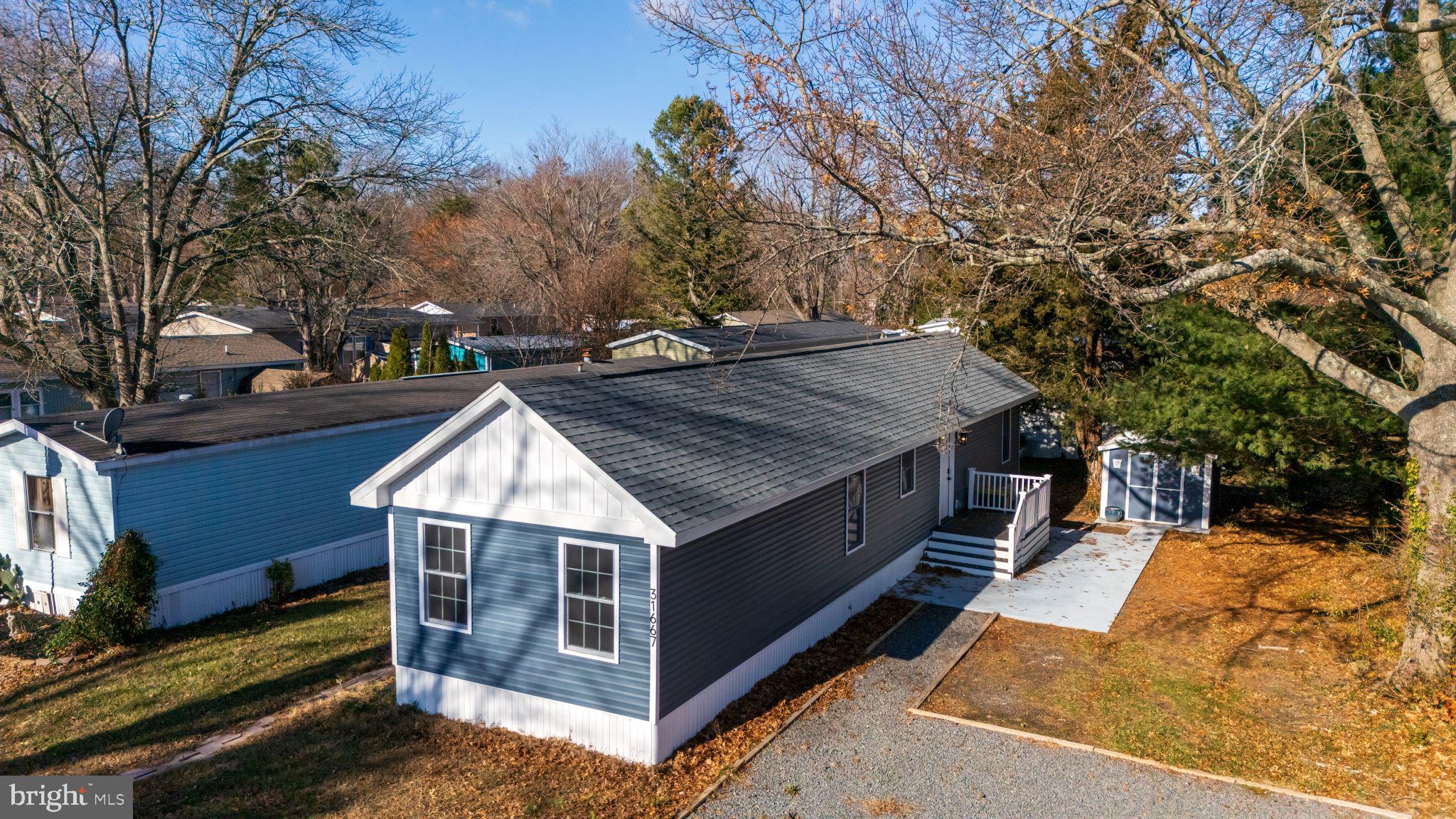 Back on the market at no fault of the sellers. Welcome to this beautifully renovated 3-bedroom, 2-bathroom manufactured home located in the peaceful Whispering Pines community of Lewes, Delaware. Completely transformed in 2023, this home feels like new and offers a blend of modern luxury with coastal charm.

Inside, an open floor plan creates a seamless flow between the living, dining, and kitchen areas, ideal for both everyday living and entertaining. The kitchen is a showpiece, featuring vaulted ceilings that amplify the sense of space, a full-height subway tile backsplash for timeless elegance, and warm butcher block countertops that perfectly complement sleek grey cabinetry and stainless steel appliances. Whether you're preparing a casual meal or hosting a dinner party, this space will inspire your culinary creativity.

The three generously sized bedrooms include walk-in closets, offering plenty of space and storage. Double entry doors at both the front and back of the home add convenience and charm and a separate shed provides additional storage for seasonal items or tools.

The Whispering Pines community is tranquil, with well-maintained surroundings that enhance the peaceful living environment. Located just off Route 1, you’ll enjoy easy access to shopping centers, dining options, parks, bike paths, and some of the most beautiful beaches in Delaware. For outdoor enthusiasts, there are numerous recreational opportunities in the area, including state parks, wineries, and breweries. The community also offers a pool, lawn care, and trash services included in the monthly fee, ensuring a low-maintenance lifestyle.

This home sits on leased land, with a monthly fee of $852.5, which covers access to all the community amenities. Seller is willing to cover the first three months of lot rent with a valid offer.

Located within the highly-rated Cape Henlopen School District, this home is an excellent option for those seeking a relaxed and convenient coastal lifestyle.

Fully renovated, beautifully maintained, and in a prime location, this home is truly one of a kind