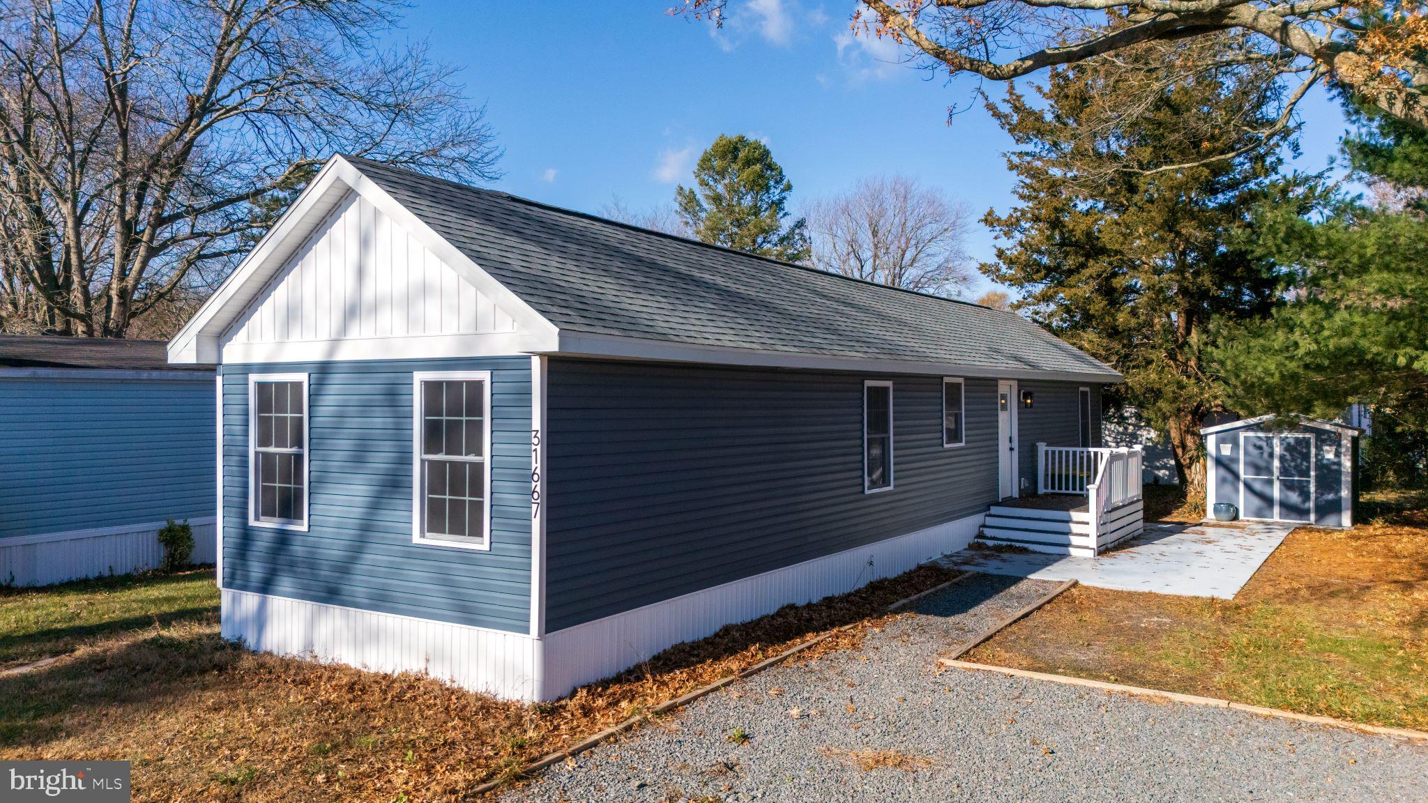 Welcome to this fully renovated 3-bedroom, 2-bathroom manufactured home in the peaceful Whispering Pines community of Lewes, Delaware. Thoughtfully transformed in 2023, this compact home offers updated finishes, flexible bedroom space, and a low-maintenance coastal lifestyle just minutes from Route 1.

Inside, the home has been refreshed with a modern coastal feel throughout. The kitchen is a standout feature with vaulted ceilings, full-height subway tile backsplash, warm butcher block countertops, grey cabinetry, and stainless steel appliances. The updated finishes give the home a clean, move-in ready feel while keeping the layout practical and easy to maintain.

The three-bedroom layout provides flexibility for a variety of needs. Use the bedrooms for guests, a home office, hobby space, or additional storage depending on your lifestyle. Walk-in closets offer added functionality, and the two full bathrooms make the home comfortable for everyday living or hosting visitors.

Outdoor storage is another major benefit of this property. The separate shed provides valuable space for beach gear, bikes, tools, seasonal items, or anything you do not want taking up room inside the home. Double entry doors at both the front and back of the home add convenience and easy access.

Whispering Pines offers a quiet setting with well-maintained surroundings and community amenities, including a pool, lawn care, and trash service. Located just off Route 1, this home offers easy access to shopping, dining, bike paths, parks, a winery, breweries, and Delaware’s beaches.

This home is located on leased land with a monthly lot rent of $992. The seller is willing to cover the first three months of lot rent with a valid offer. This renovated home is a great option for buyers seeking an updated, manageable home in a convenient coastal location.