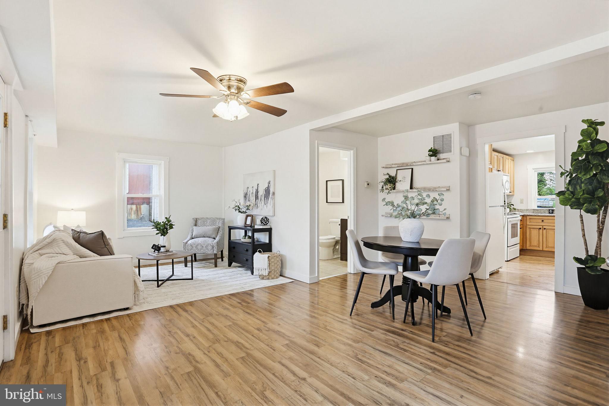 Welcome to this charming and updated farmhouse-style home in the heart of Woodsboro. Originally built in 1900 and fully renovated in 2016, this property beautifully blends classic character with modern updates. Throughout the home, you'll find updated flooring, fresh paint, recessed lighting, and energy-efficient systems including a newer HVAC heat pump, washer and dryer and a brand new water heater. The insulation, siding, windows, roof, electrical, and plumbing have all been updated, giving peace of mind and move-in ready confidence.  Offering 3 bedrooms and 2 full bathrooms, this sun filled home features an open main level with a spacious living and dining area, a well-appointed kitchen, and a convenient main-level laundry and mudroom. Outside, enjoy the welcoming front porch, rear deck, and fenced rear yard with a storage shed—perfect for relaxing or entertaining. The property also has a well established garden including multiple berry bushes, perennials, native species, and wildflowers, and a ready to go chicken coop /run approved through the town for up to 5 chickens. Sitting on a 0.12-acre lot with both residential and commercial zoning, this home offers added flexibility for work-from-home needs or future business potential. Located just minutes from local parks, commuter routes, and highly rated Frederick County schools, this home is a rare find in a quaint small-town setting—no HOA and full of charm!