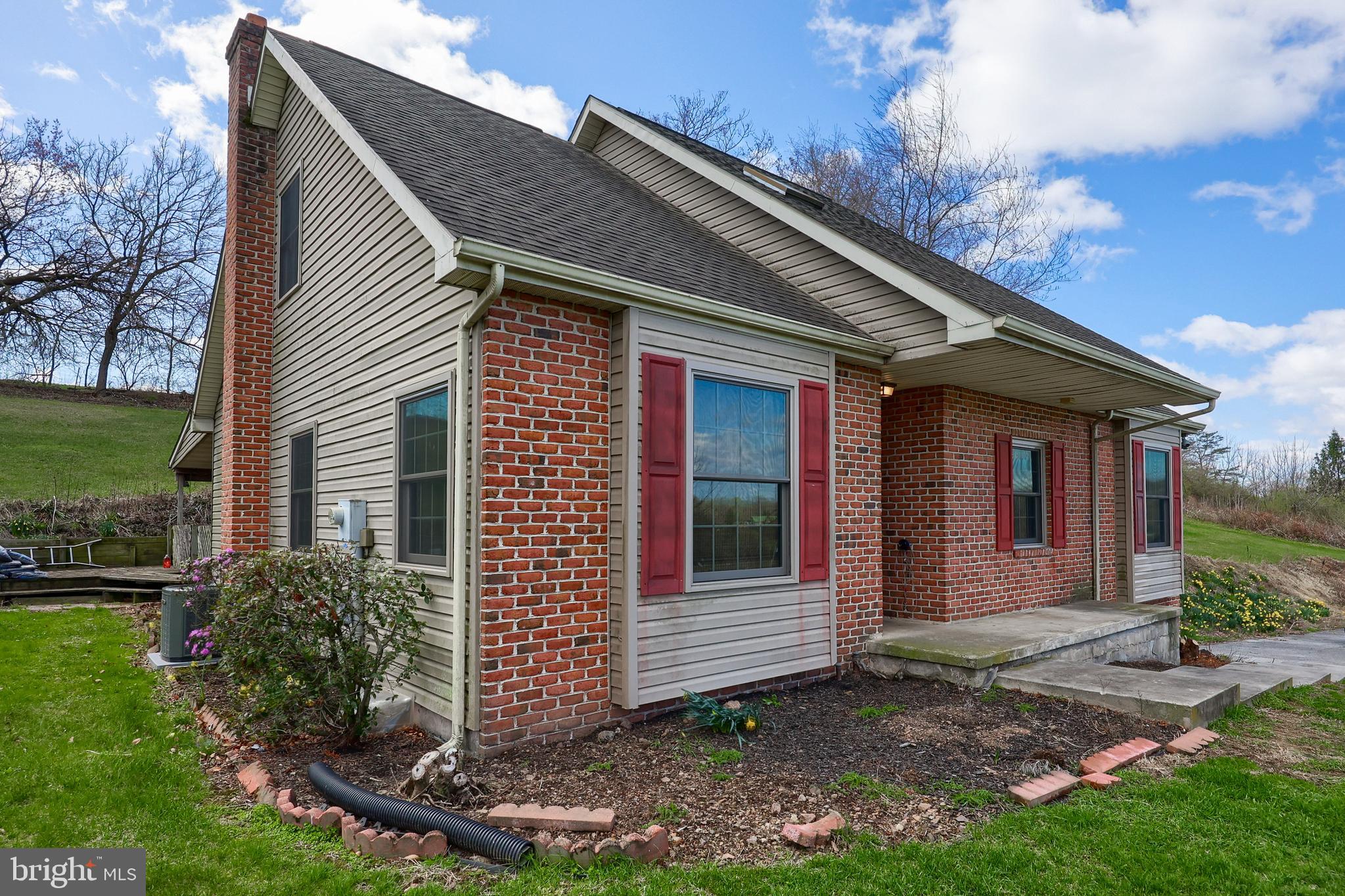 Are you looking for a nice home in a rural setting on over 4 acres with a sizable detached 2 car garage and barn for a horse. Home features a first-floor owners suite with 3 additional bedrooms, the 4th bedroom is in the walk out lower level.  Lower level has an integral garage, with a large utility room and a bonus room.
Laundry on 1st level, 1/2-bathroom, formal dining room, large kitchen with plenty of cabinets. Second level features 2 bedrooms, bathroom, and don't forget to check out the Walkin large storage area that covers the rear length of the home. With a little effort this will make a great home
Home has had recent improvements; Renewal by Anderson Windows, Air condition, roof, hot water 
heater.