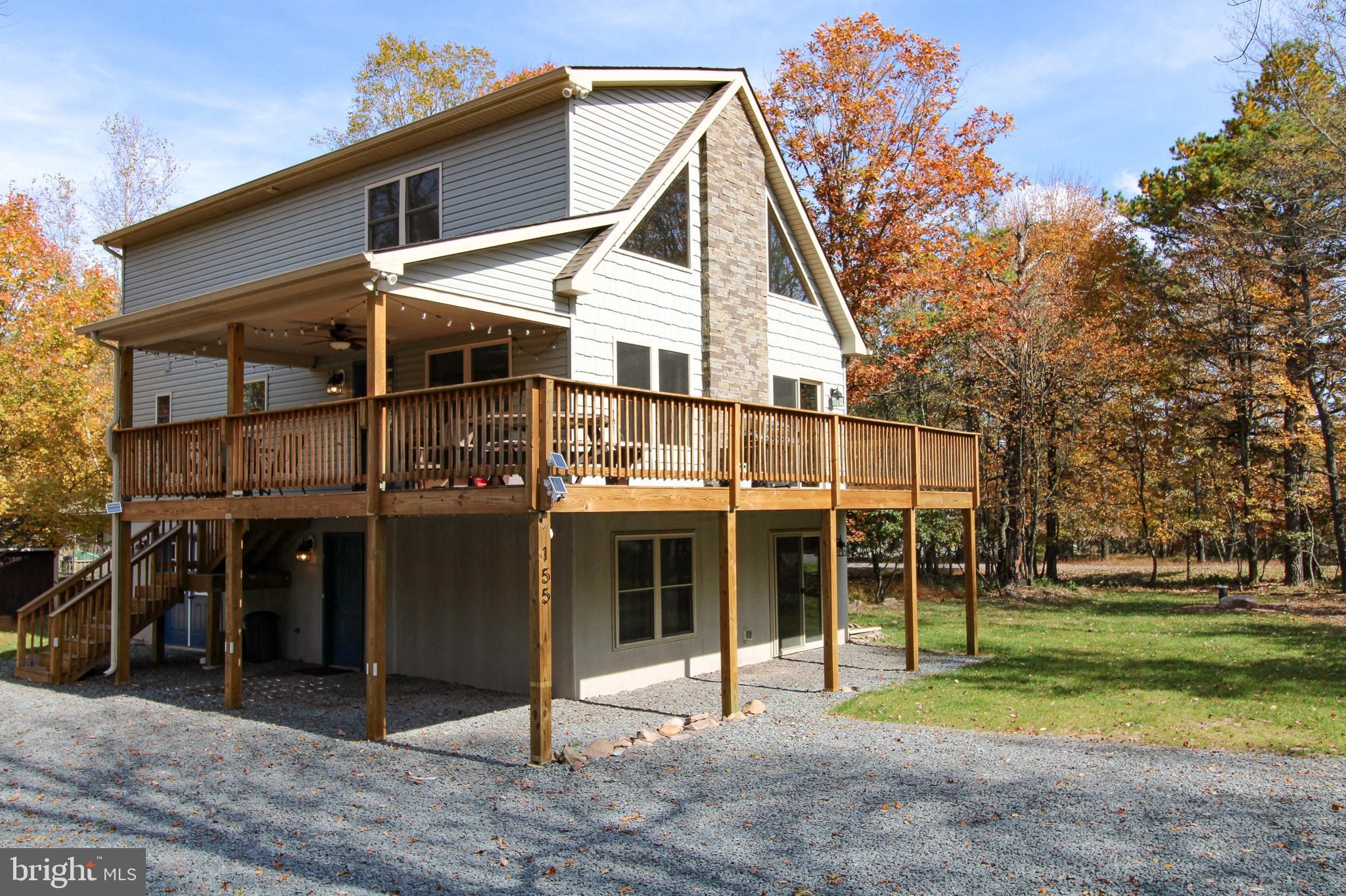 Pristine Home in Towamensing Trails. Built in 2021 offering a blend of rustic charm and modern comfort. Meticulously crafted property spanning .72 acres of natural beauty. The home itself has 4 bedrooms and 3 bathrooms with an open-concept, designed to provide both sanctuary and entertainment. House Features: Great room with Cathedral Ceilings. Stone Fireplace. Engineered Hardwood Floors. Quartz Countertops & Vanities, Stainless Steel appliances. Large family room with walk out to wraparound deck. Maintained Yard and Landscaping. Comes Fully Furnished & includes HOT TUB! Whether you're looking for a year-round residence, a vacation getaway, or an investment property, this home offers endless possibilities. If you're ready to turn this dream into a reality Schedule a showing today