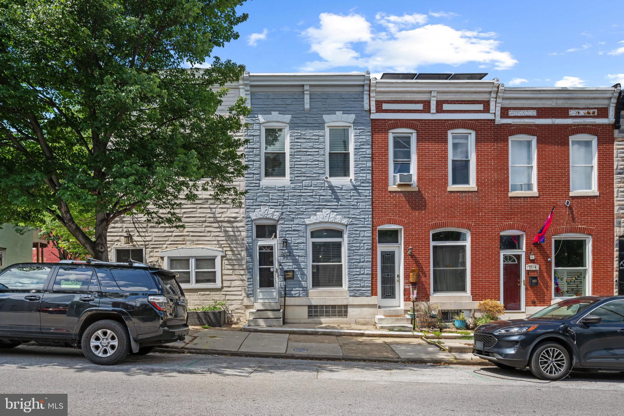 Beautifully updated rowhome residence offering 2 bedrooms, 2 full bathrooms, and 1,622 finished square feet of classic Baltimore charm in vibrant Patterson Park. Thoughtfully renovated throughout in 2019 and 2020, including the kitchen, flooring, roof, bathrooms, and HVAC system, this home seamlessly blends modern finishes with timeless character. The open-concept main level welcomes you directly into a spacious living room accented by a ceiling fan and flowing effortlessly into the dining area. The stunning eat-in kitchen serves as the centerpiece of the home, featuring a center island with breakfast bar seating, pendant lighting, white shaker-style cabinetry, stainless steel appliances, including a 5-burner cooktop and double ovens, open shelving, recessed lighting, two sinks, a pot filler, a brick backsplash, pantry storage, and exterior access. Upstairs, the owner's suite offers dual closets, a built-in wardrobe, and an attached private bathroom featuring a floating vanity and a shower with a built-in bench. A second bedroom provides the potential for a future balcony, while an additional full bathroom is conveniently located in the hallway. Both bathrooms showcase custom tile work and stylish finishes. The finished lower level expands the living space with a recreation room featuring plush carpeting and ample closet storage, ideal for entertaining, lounging, or a media space, along with a versatile bonus area with your laundry facilities.  Outdoor living includes a deck that steps down to a private fenced courtyard, creating the perfect setting for relaxing or entertaining.  Ideally situated just one block from the expansive green spaces, trails, and recreational amenities of Patterson Park, this home also enjoys convenient access to shopping, dining, nightlife, and I-95 for an easy commute. Noteworthy upgrades include a Roof replaced (2019), windows and storm door replaced (2020), HVAC replaced (2020),